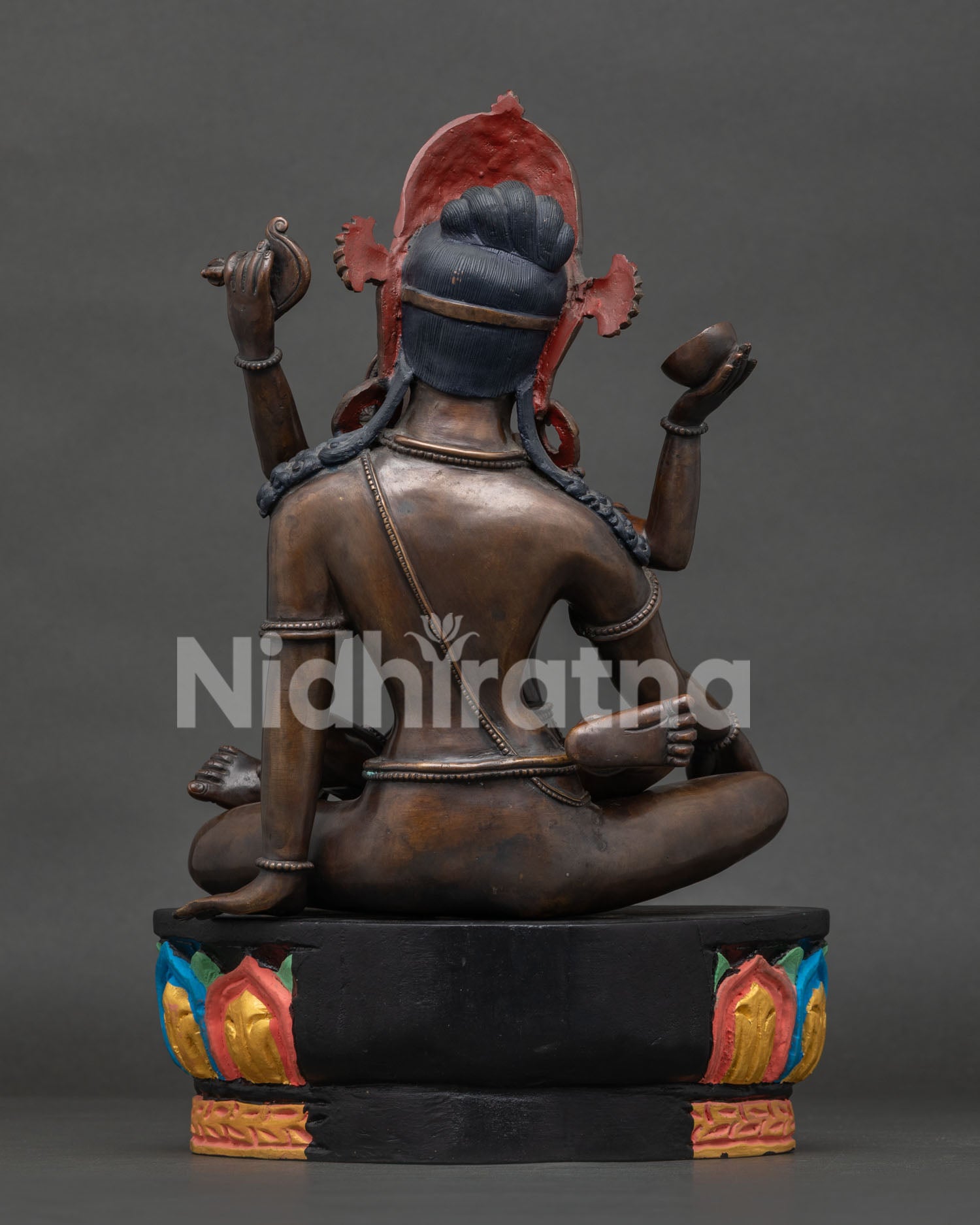 Back view of handcrafted Indra with consort statue by Newari artisans.