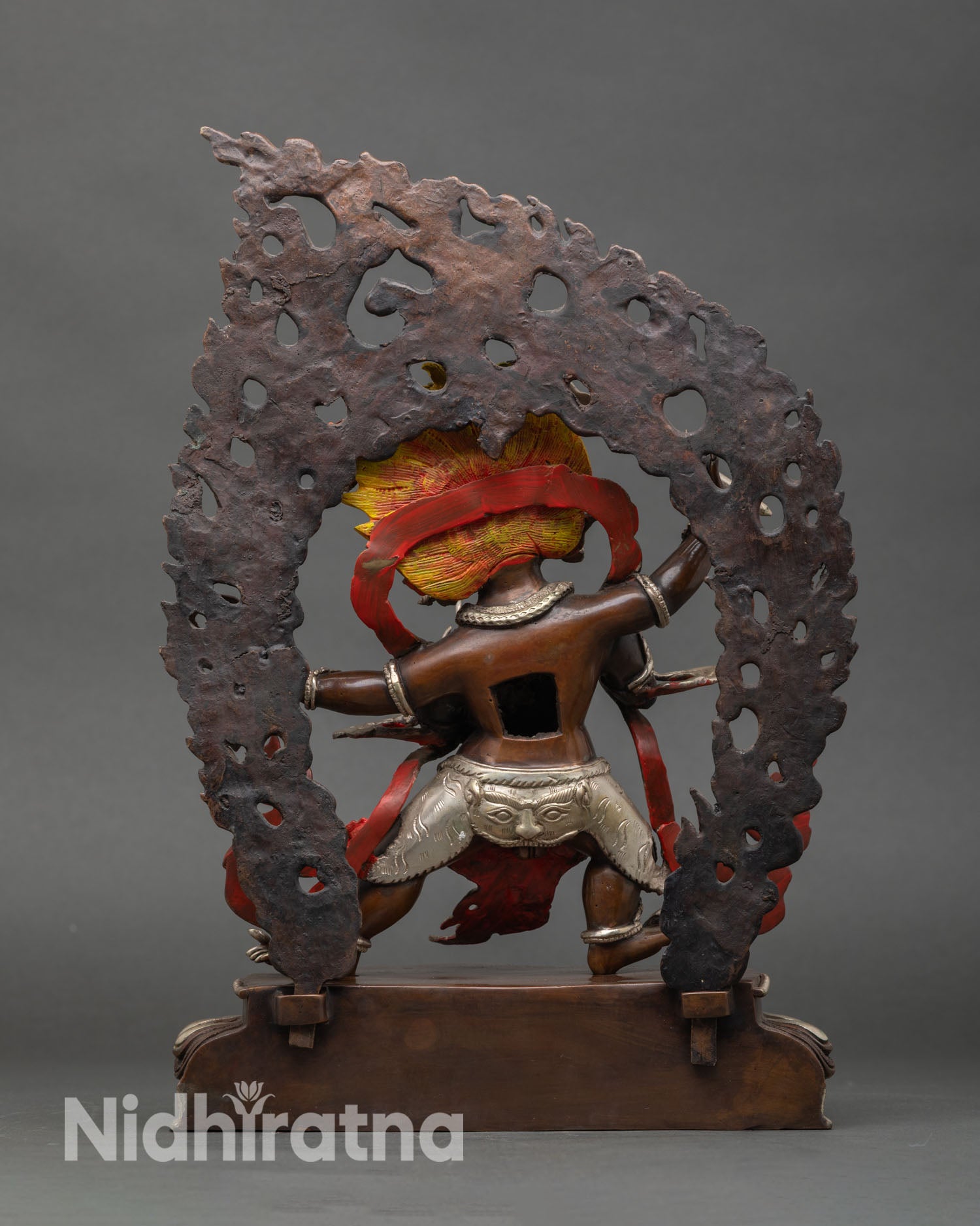 Back view of handcrafted Vajrapani statue from Patan Nepal copper sculpture oxidized finish silver plated details sacred altar decor Himalayan Buddhist art