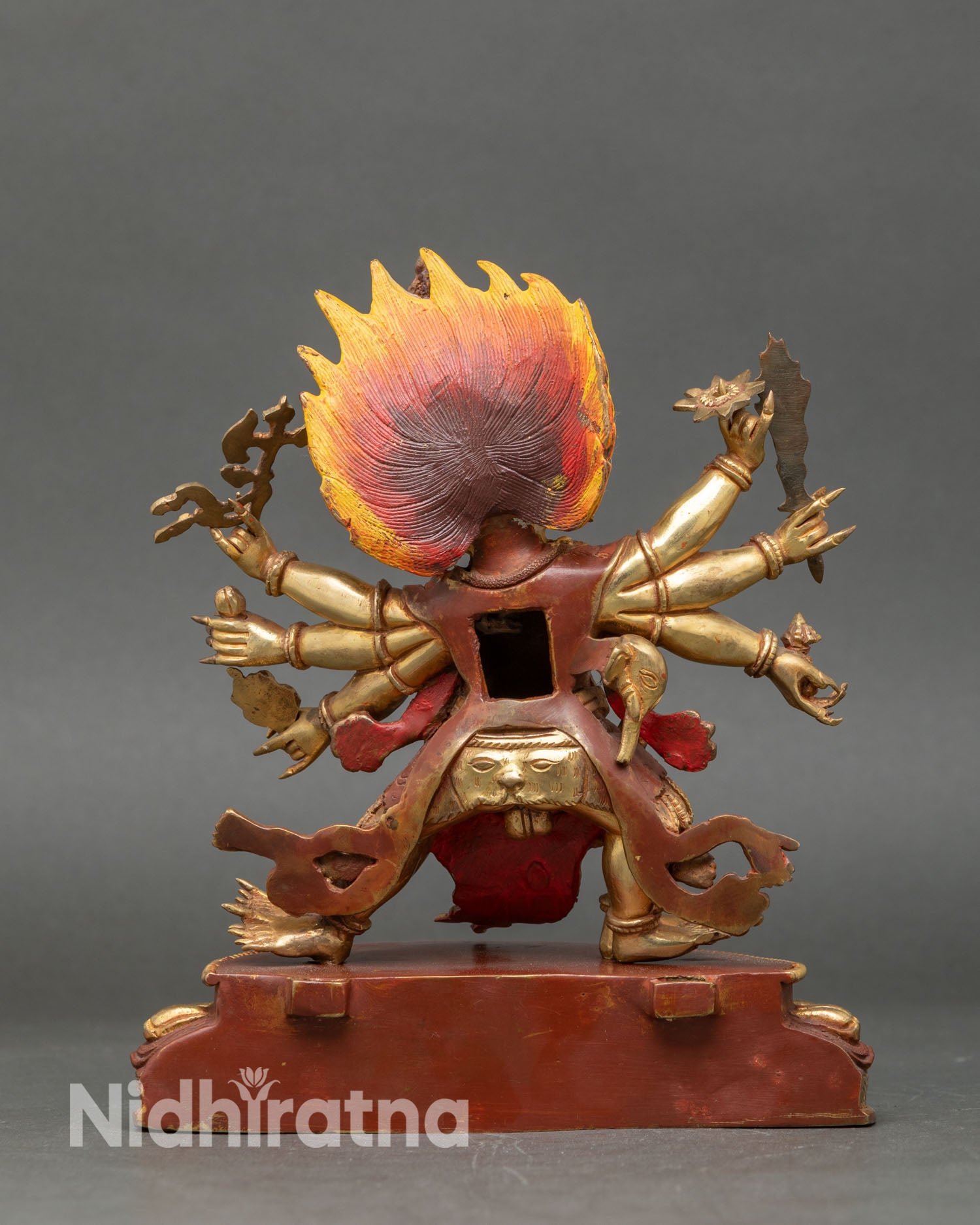 Back view of a handmade Mahakala statue from Patan, Nepal, copper sculpture, gold gilded, sacred Buddhist altar decor, Himalayan protection art