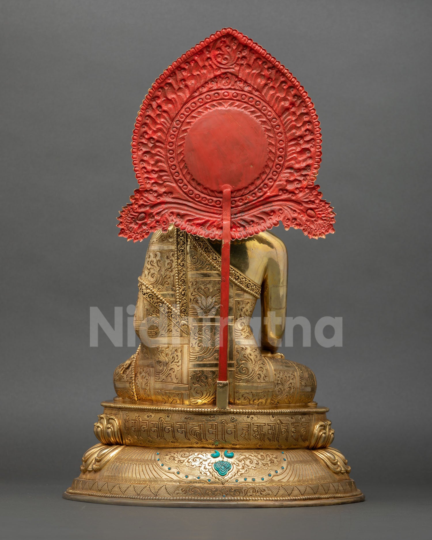 Back view of handmade Shakyamuni Buddha statue with decorative halo and copper craftsmanship
