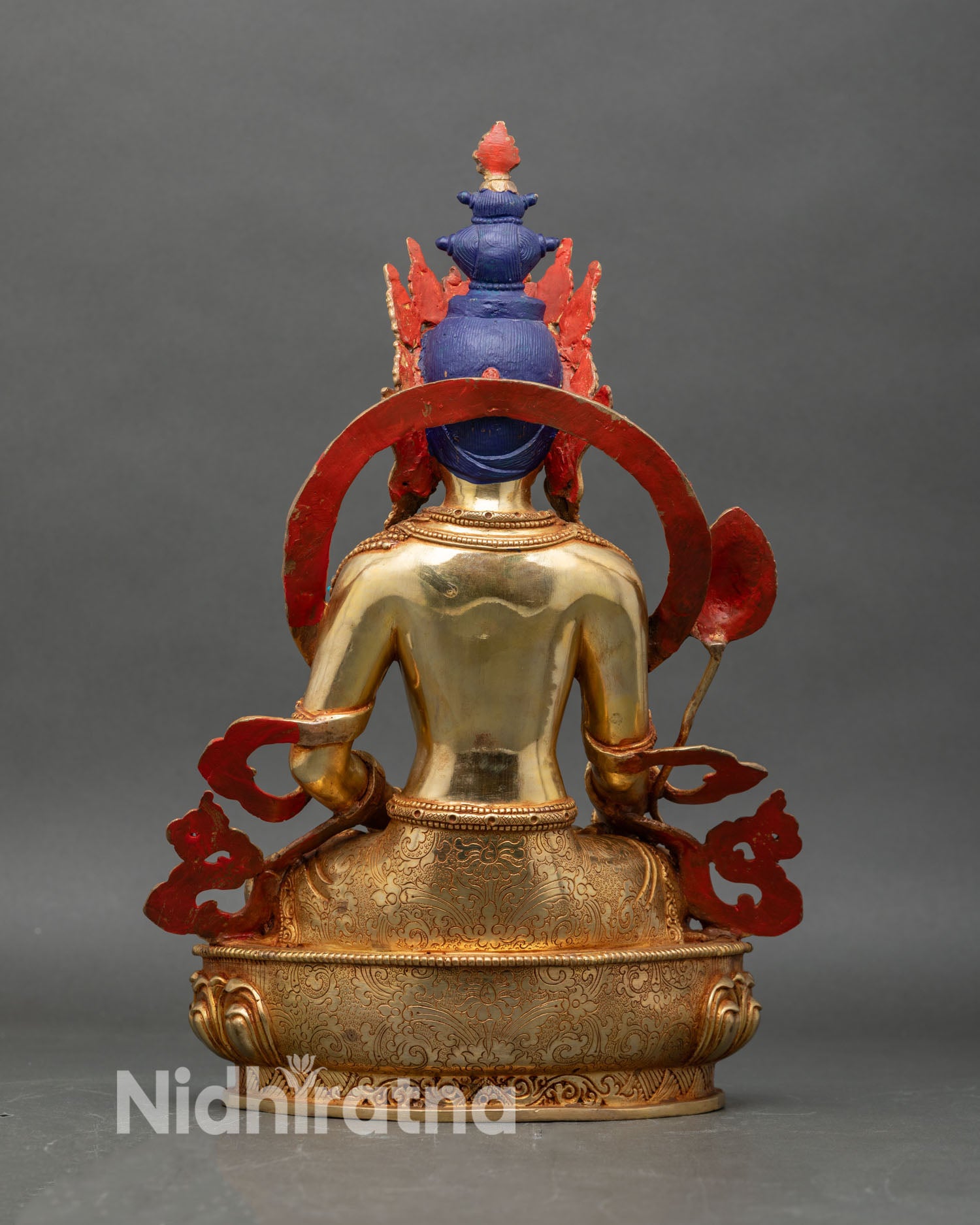 Back view of Kshitigarbha Bodhisattva statue seated on lotus pedestal for spiritual rituals