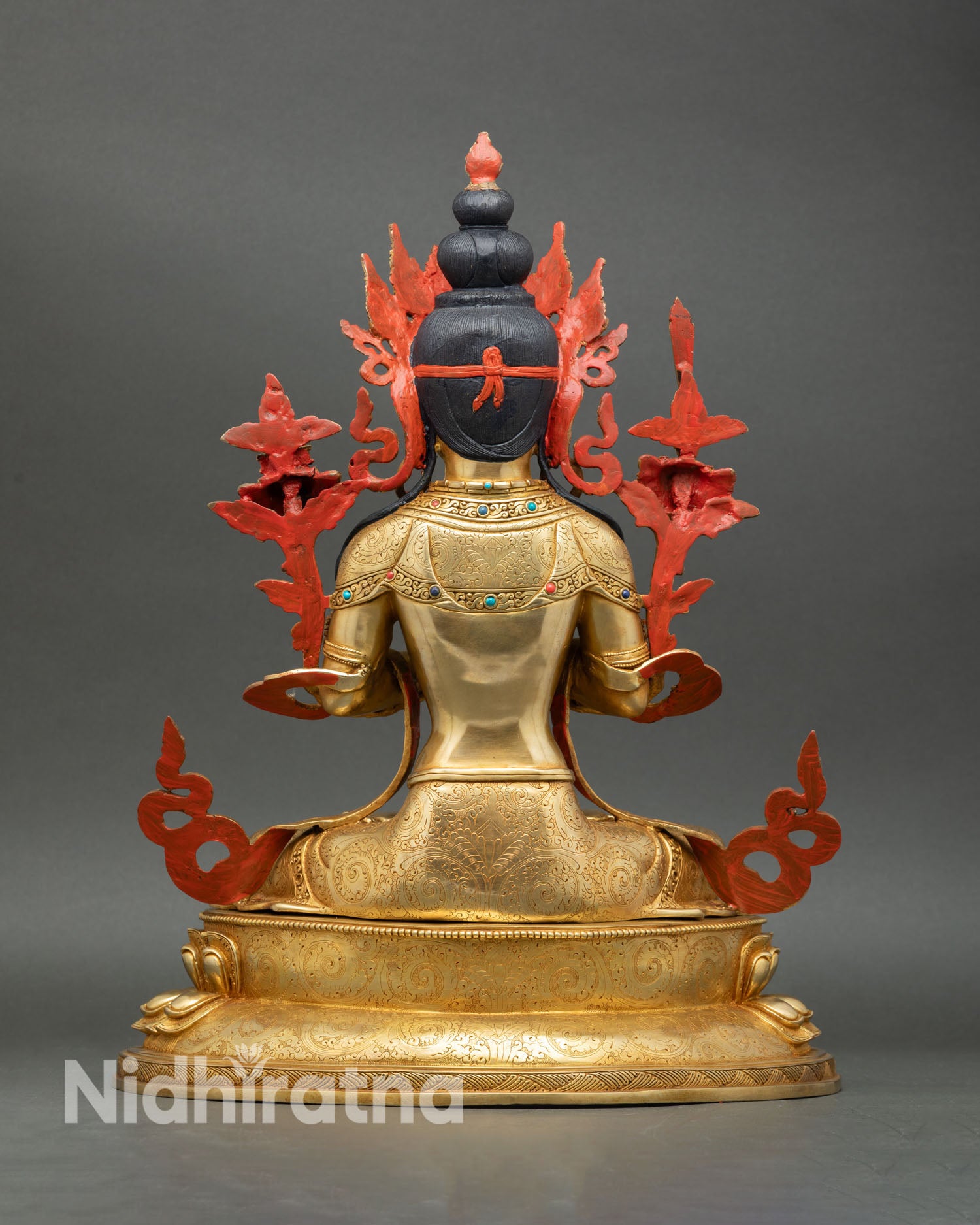 Back view of Manjushree statue handcrafted Nepal intricate carving lotus base gold gilded copper sacred Buddhist sculpture
