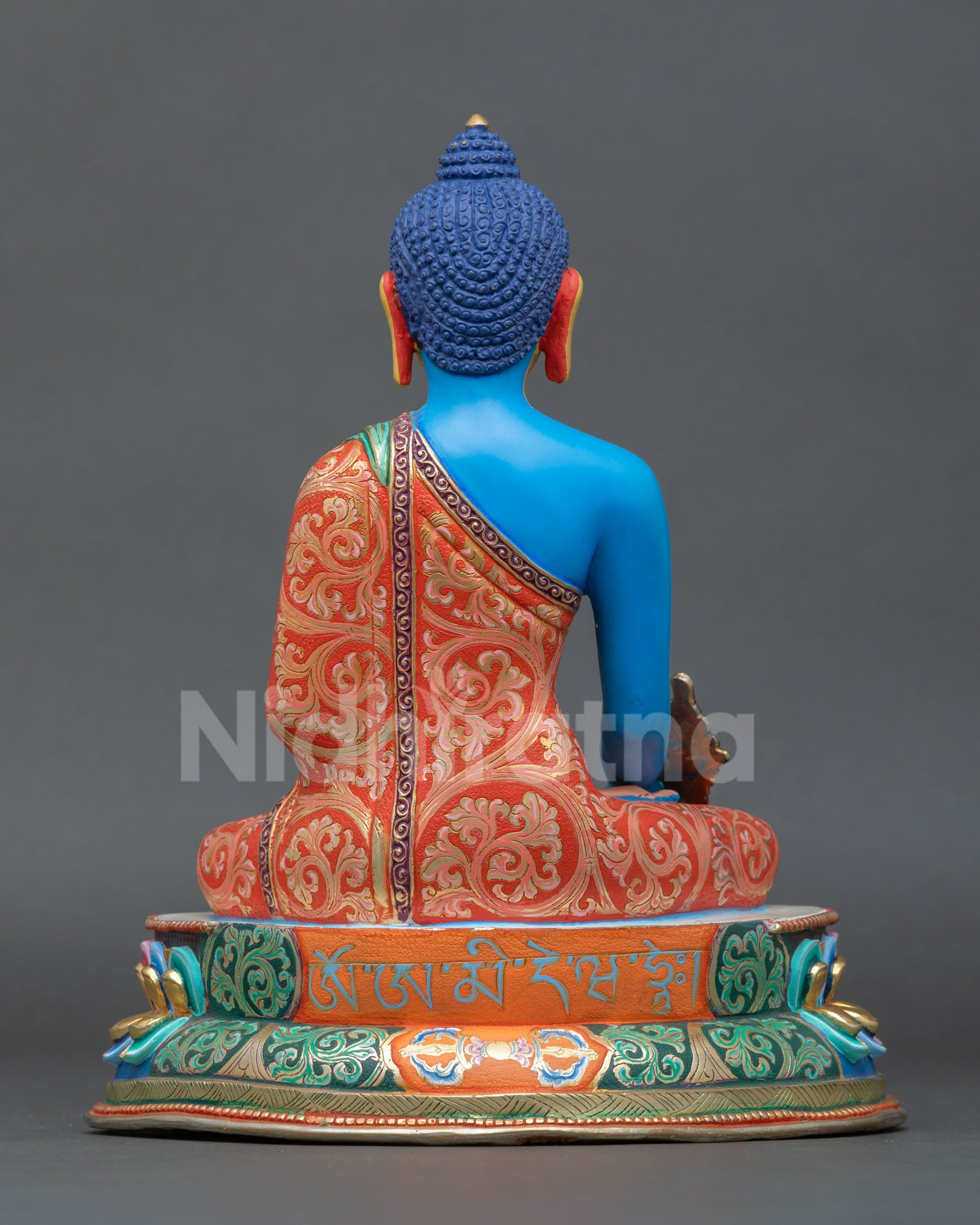 Back view of the Medicine Buddha statue with intricate carved details, lost wax casting for a spiritual home and meditation space