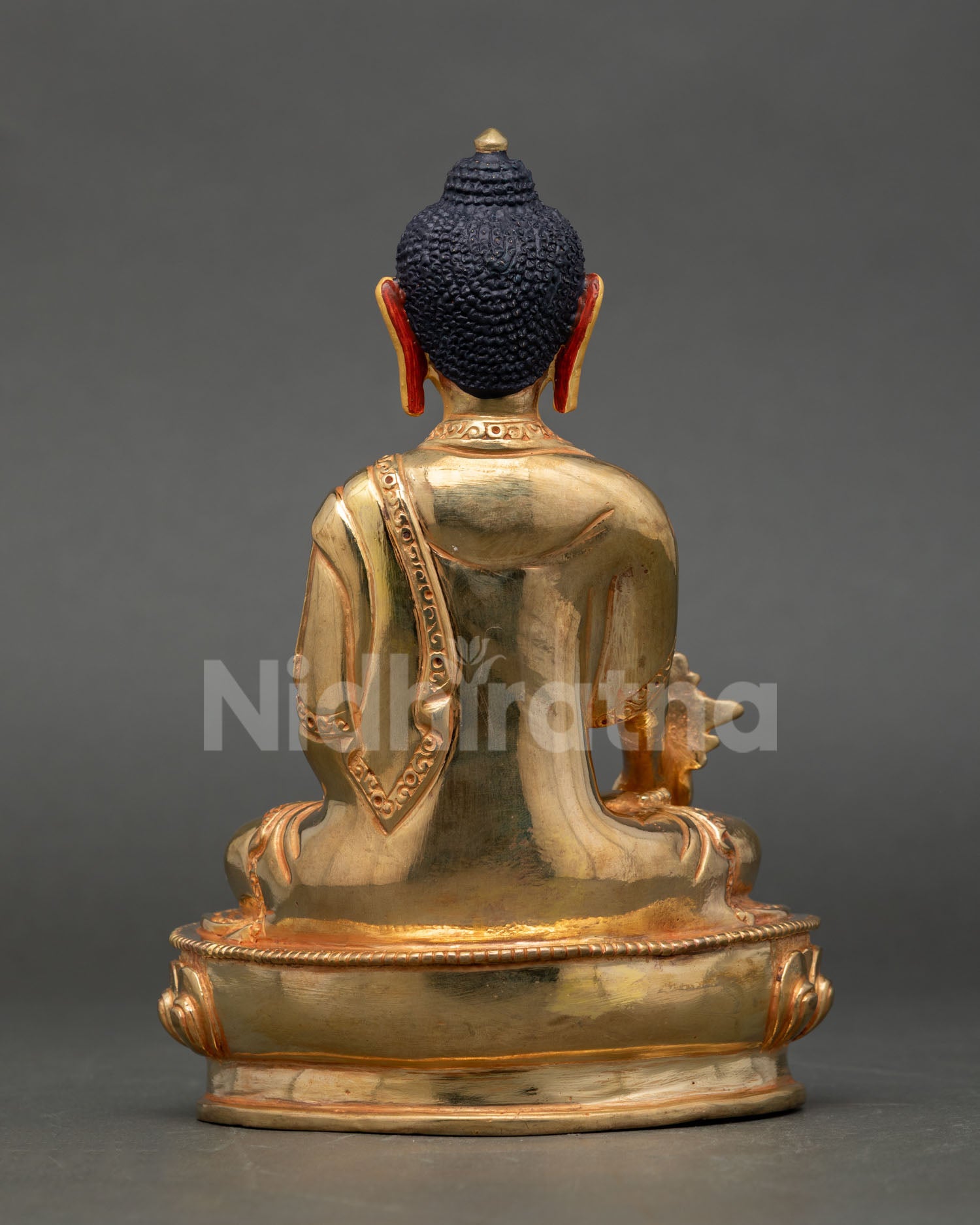 Back view of Nepal Medicine Buddha statue traditional Buddhist healing sculpture gold fire gilded copper home altar decor