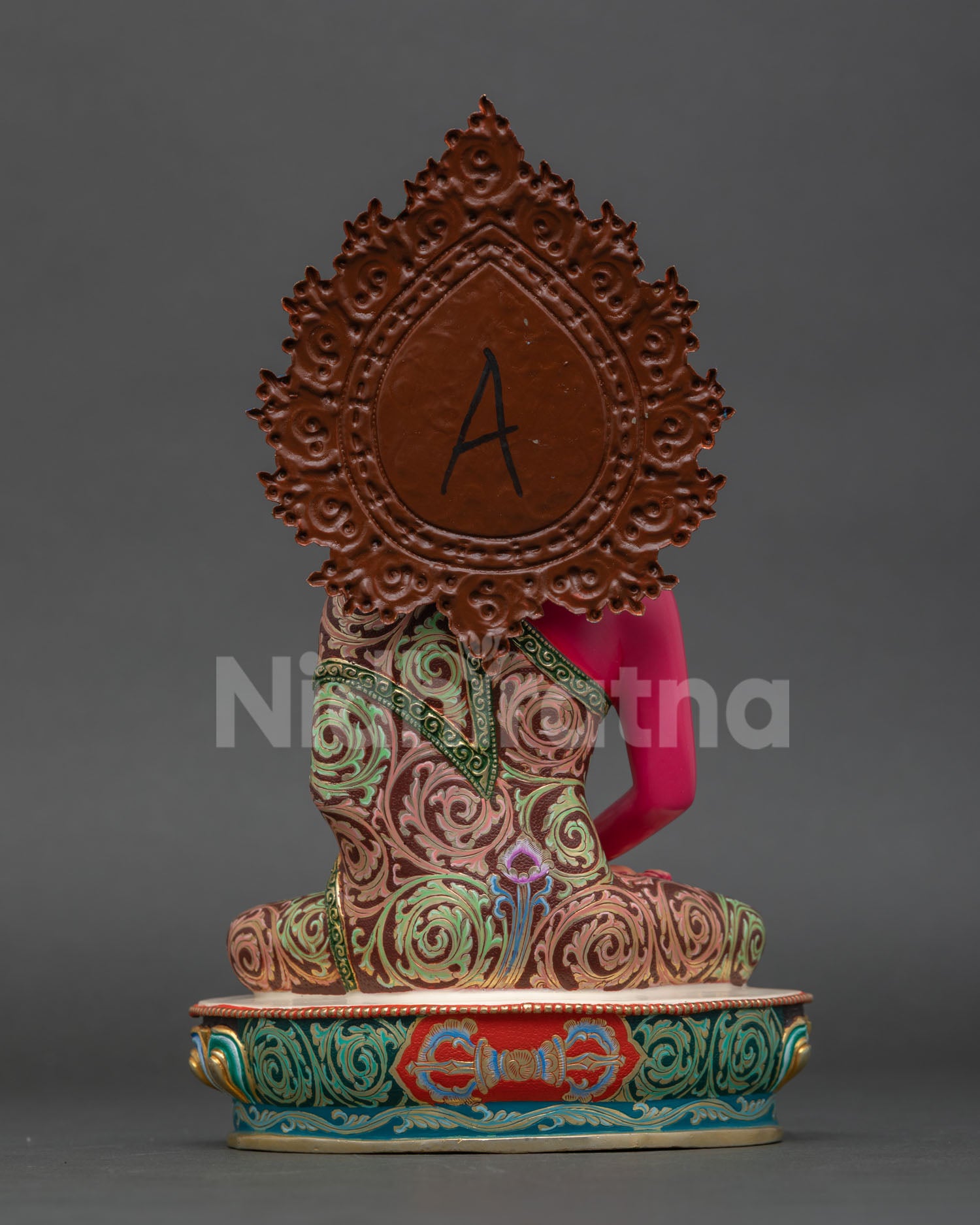 Back view pf Nepalese Amitabha Buddha statue copper handcrafted sculpture with detailed floral halo design for meditation space and sacred home decor