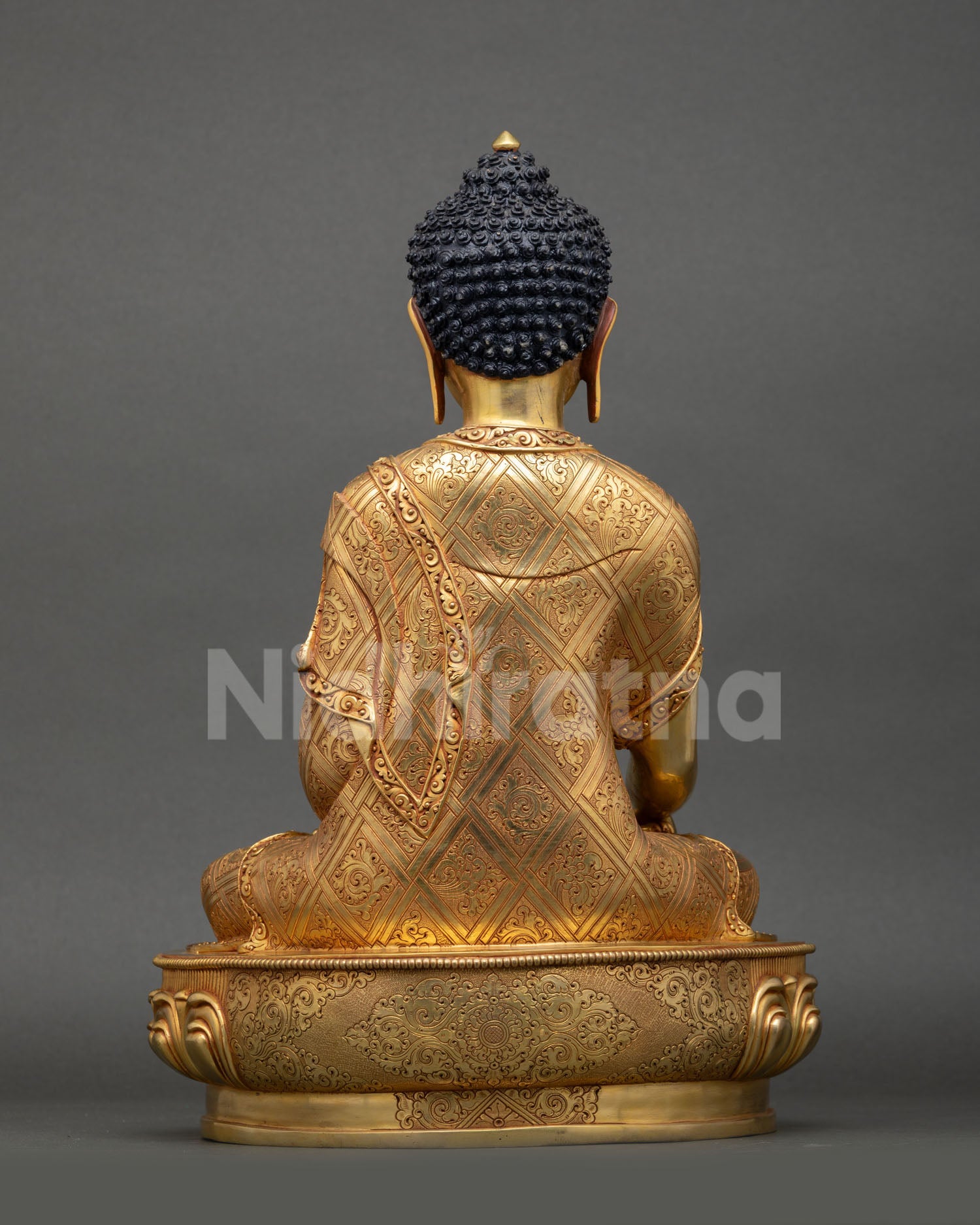 Back view of Nepalese handmade Shakyamuni Buddha statue for meditation altar decor