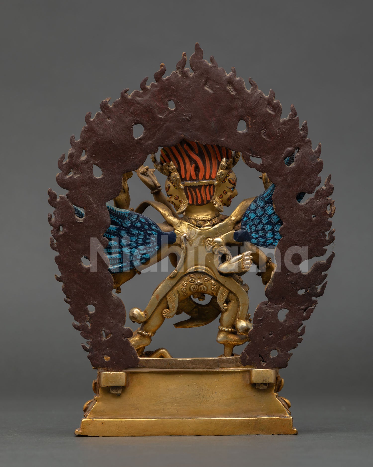 Back view of Nepalese Vajrakilaya statue with dynamic flaming halo copper base and hand painted details for meditation space