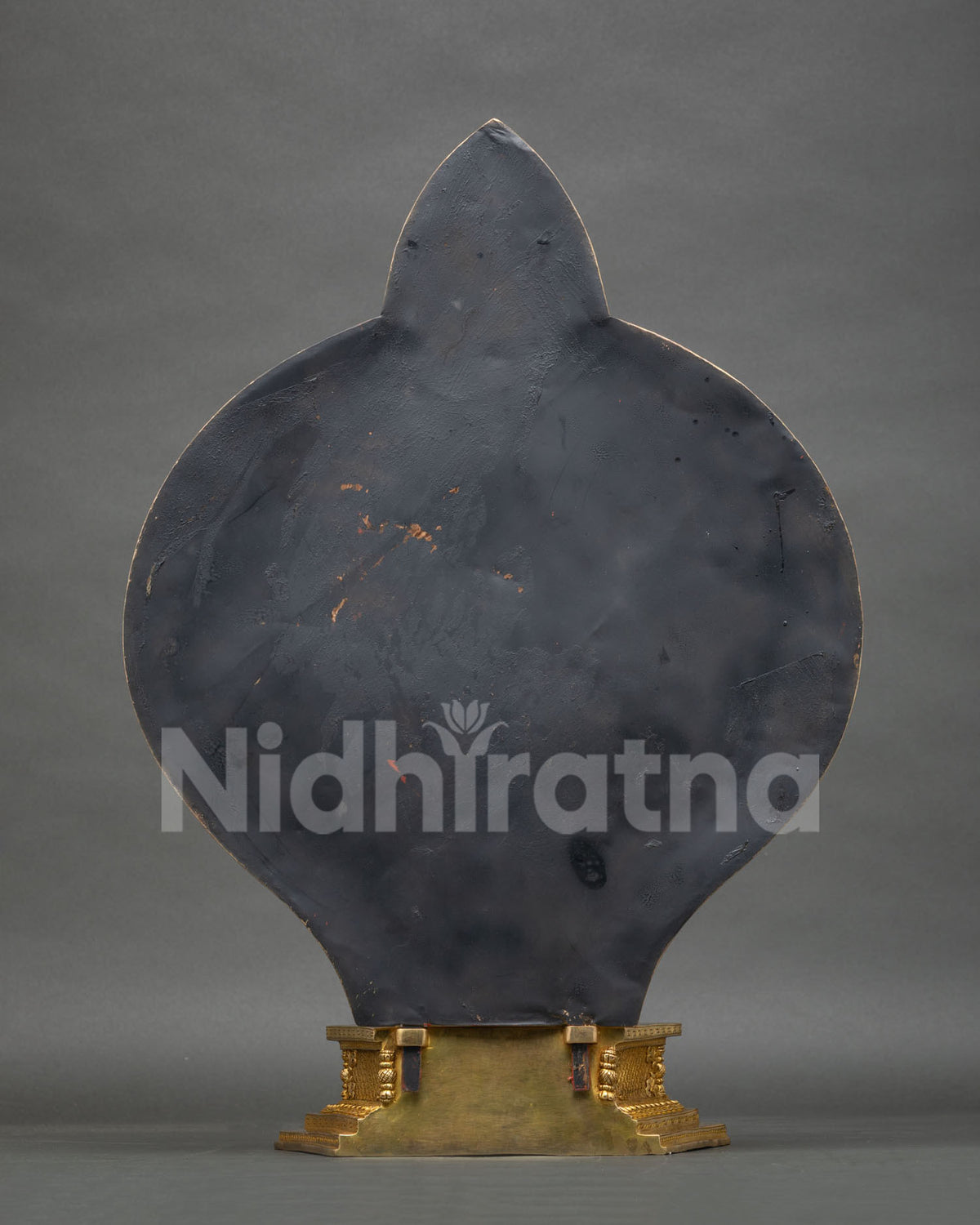 Back view of 1000 Arm Chenrezig statue with smooth halo reverse and gilded stepped base, handmade in Nepal