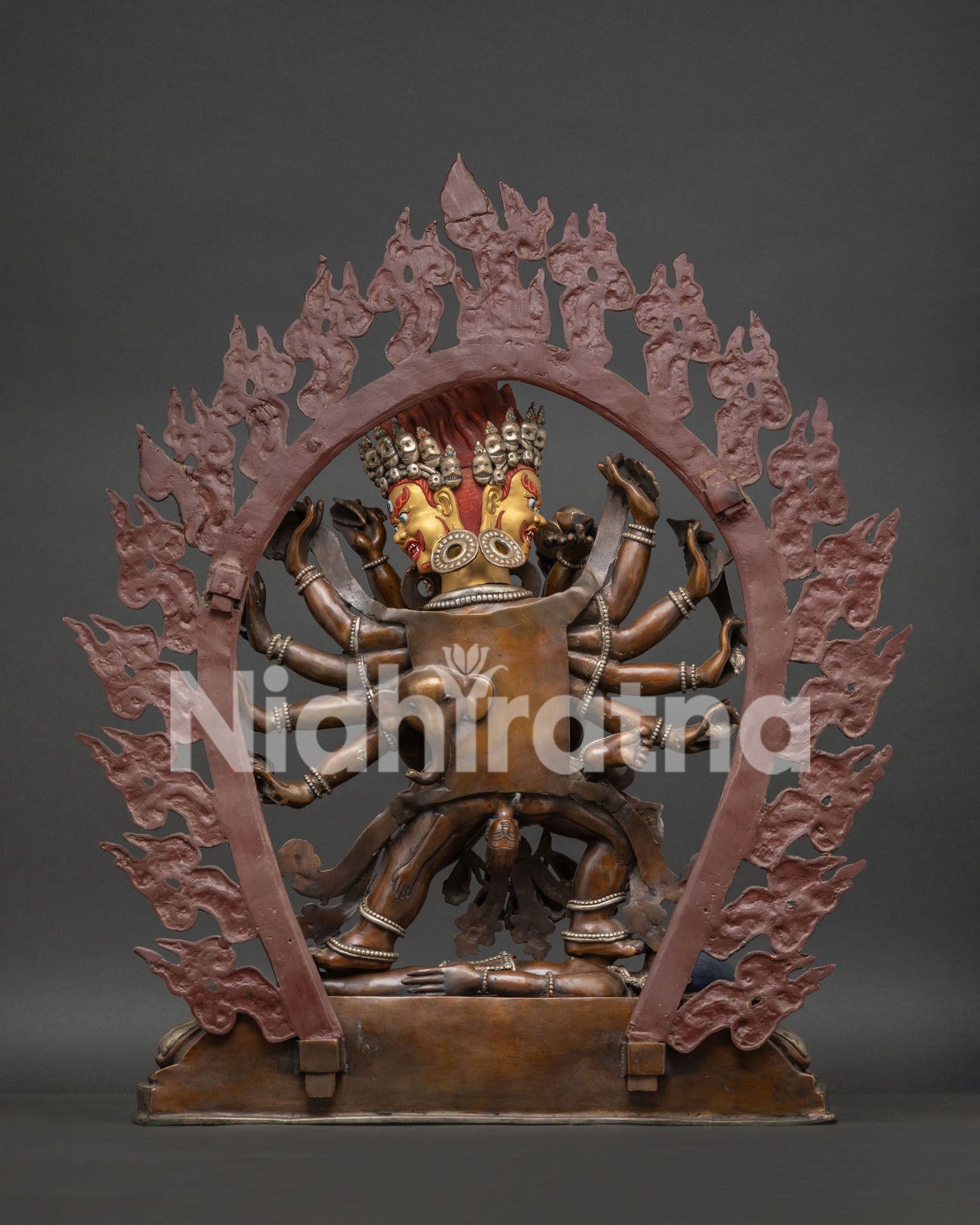 Back view of 14-Armed Mahakala Yab-Yum oxidized copper statue showing hand-cast construction