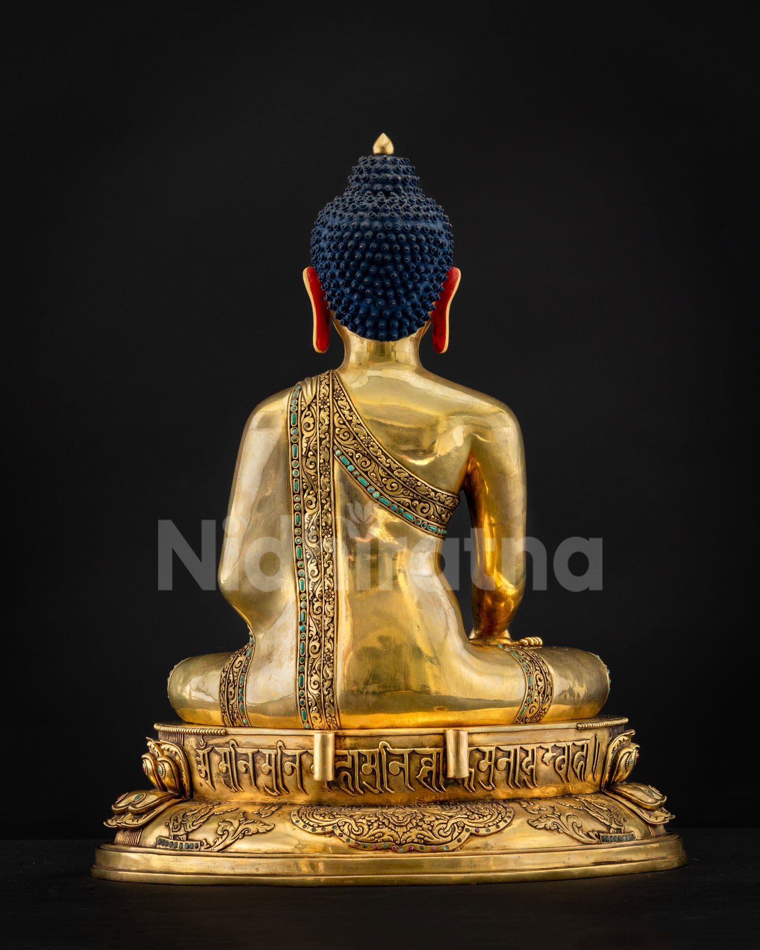 Back view of 24K gold Shakyamuni Buddha statue with Tibetan mantra-engraved pedestal base