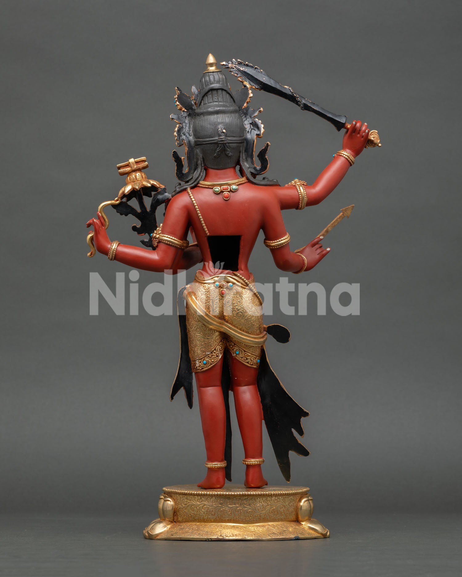 Back view of 4-Armed Maha Manjushri copper statue with gold gilding