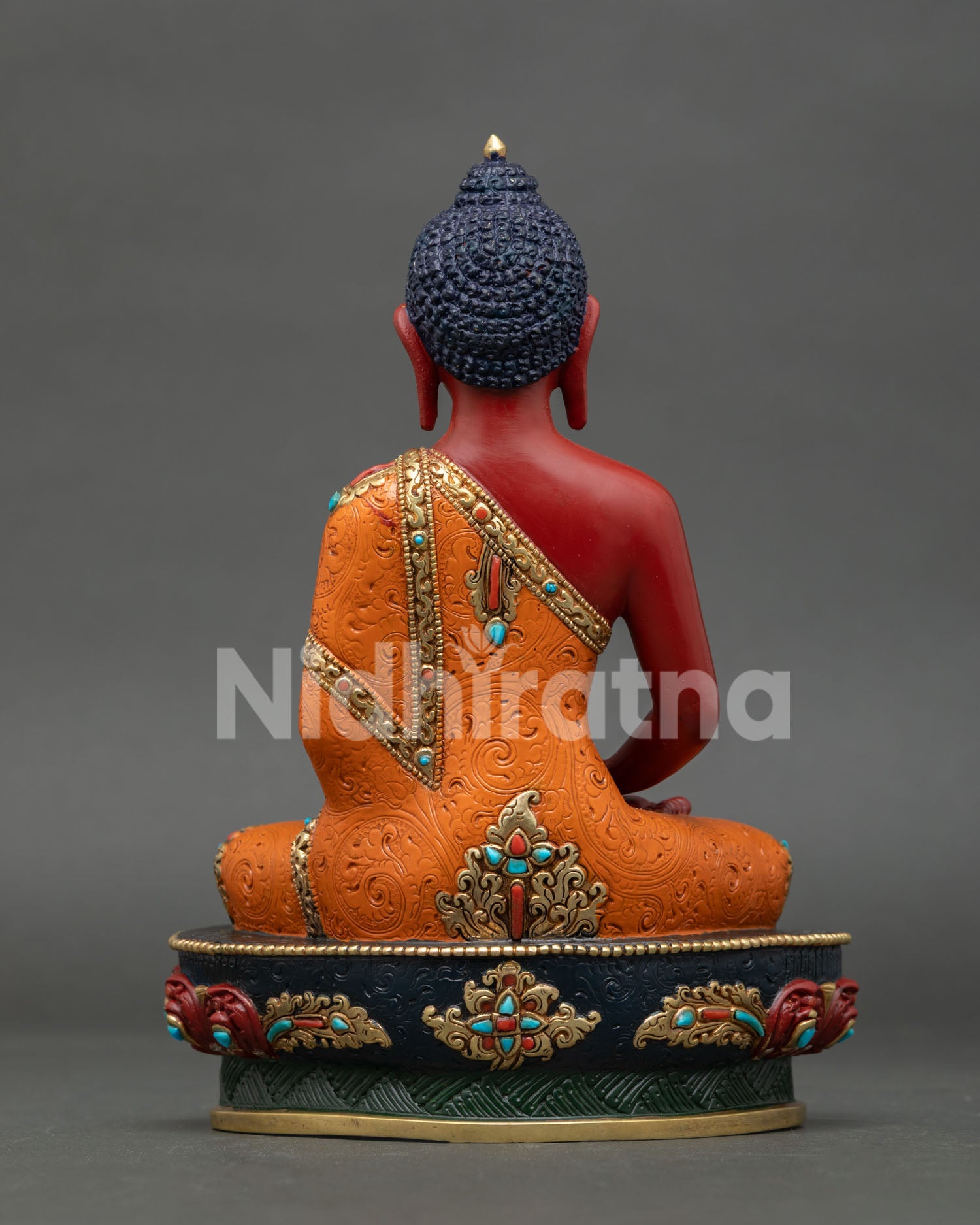 Back view of Amitabha Buddha statue showing detailed robe patterns and carvings