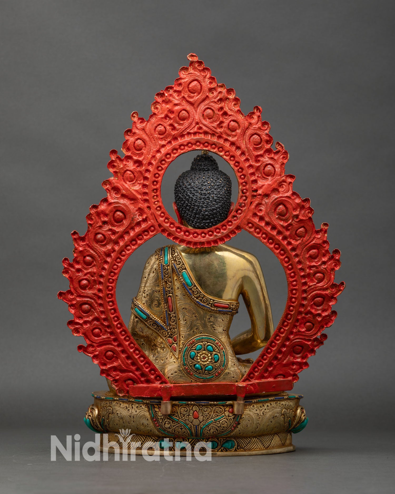 Back view of Amitabha Buddha statue with detailed halo and lotus base
