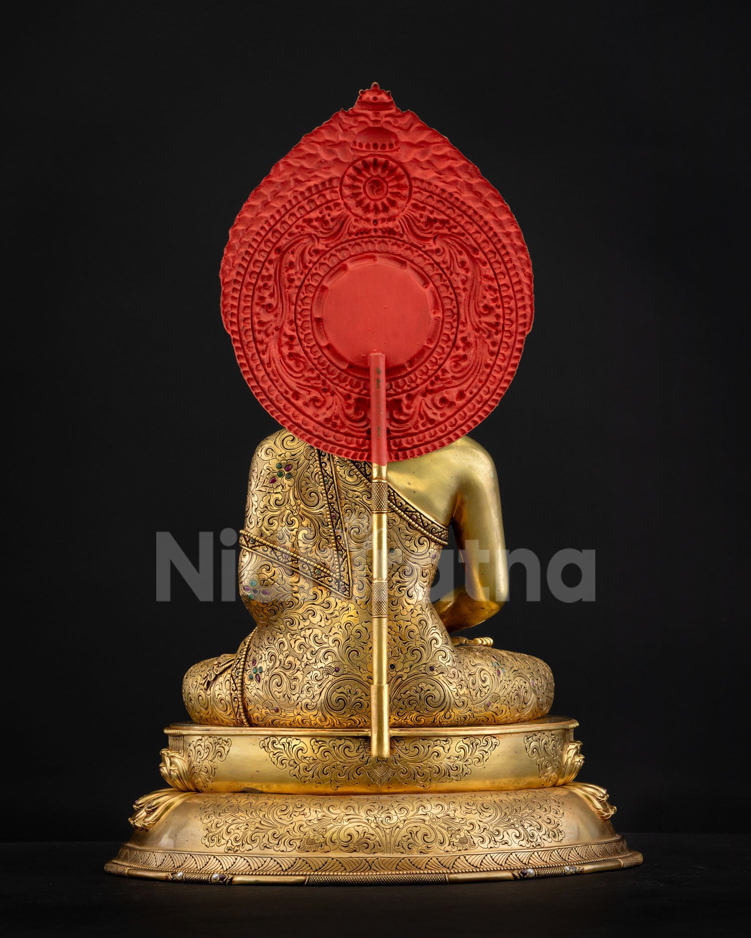 Back view of Amitabha Buddha statue with elaborately carved halo featuring lotus petals and scrollwork