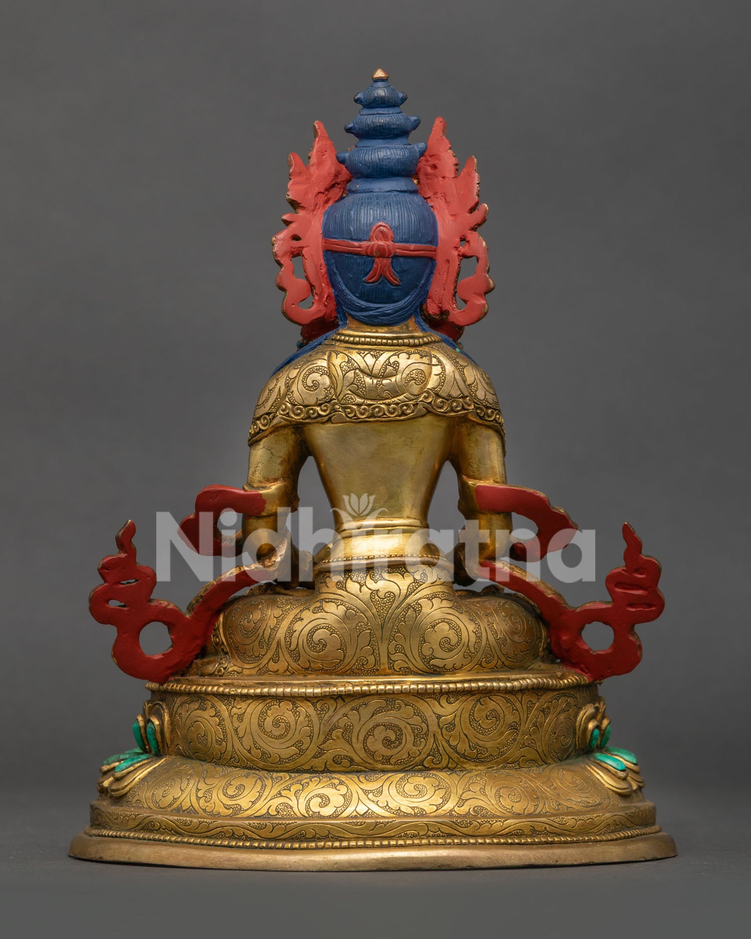 back view of amitayus statue with intricate robe engravings lotus throne and traditional nepalese artistry
