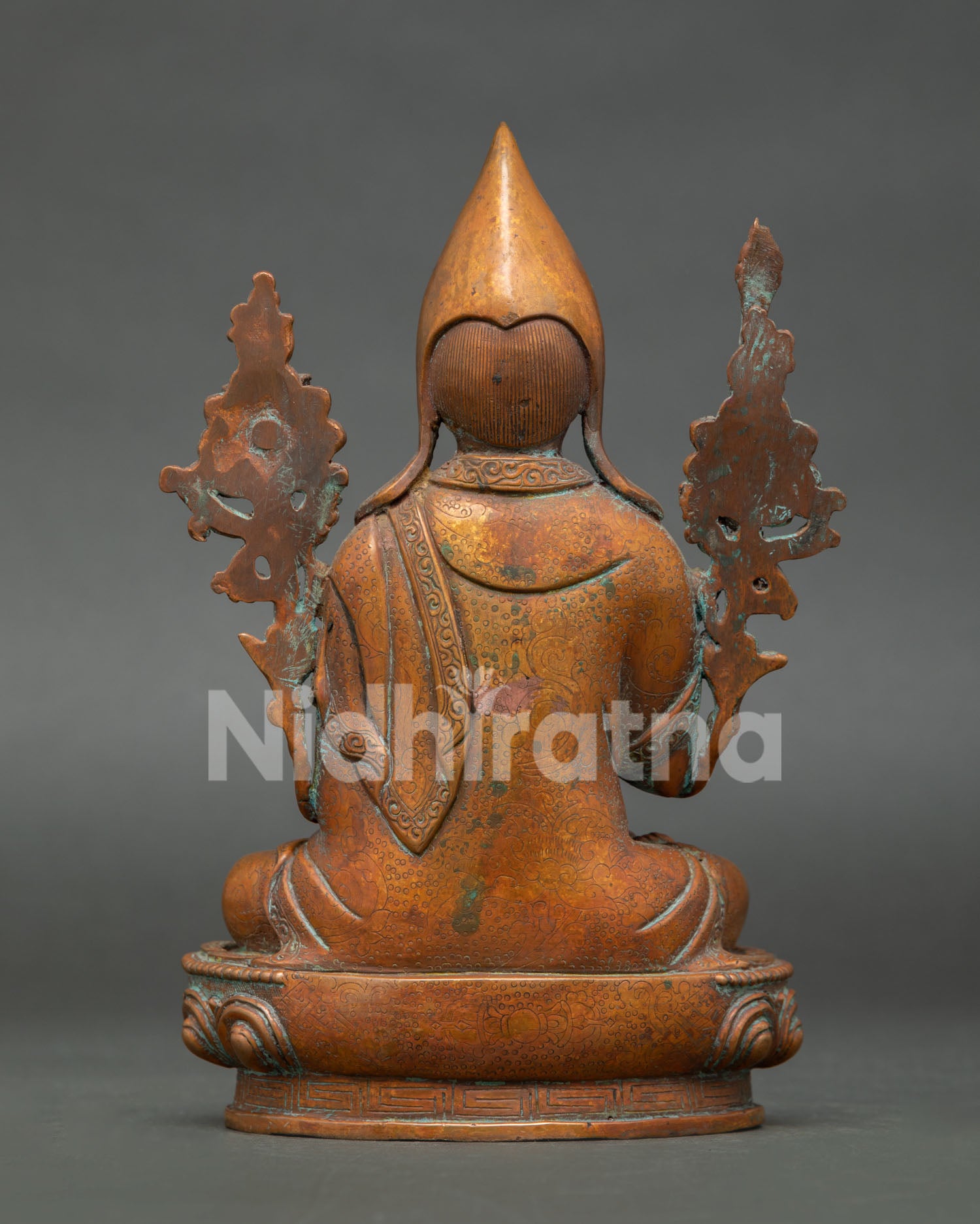 back view of antique finish tsongkhapa statue showing monastic robe details