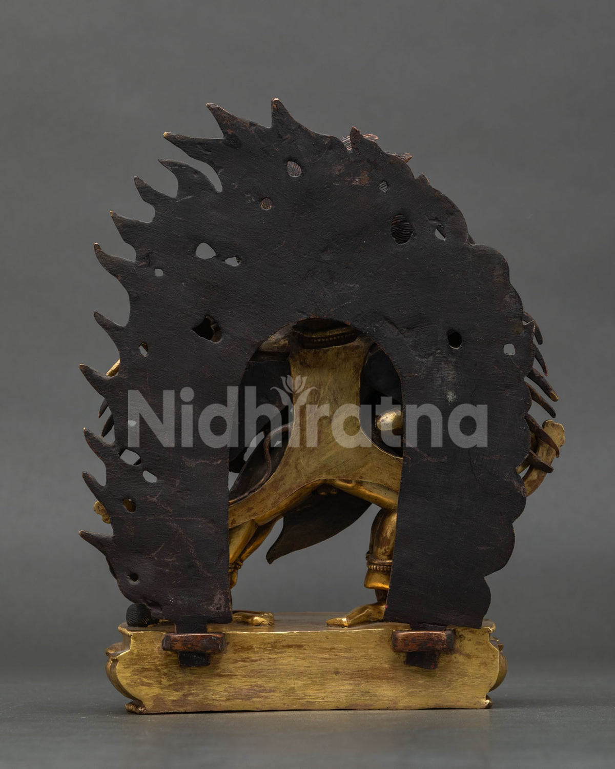 Back view of antique Hayagriva Yab-Yum statue showing flame halo and lotus base, from Nepal