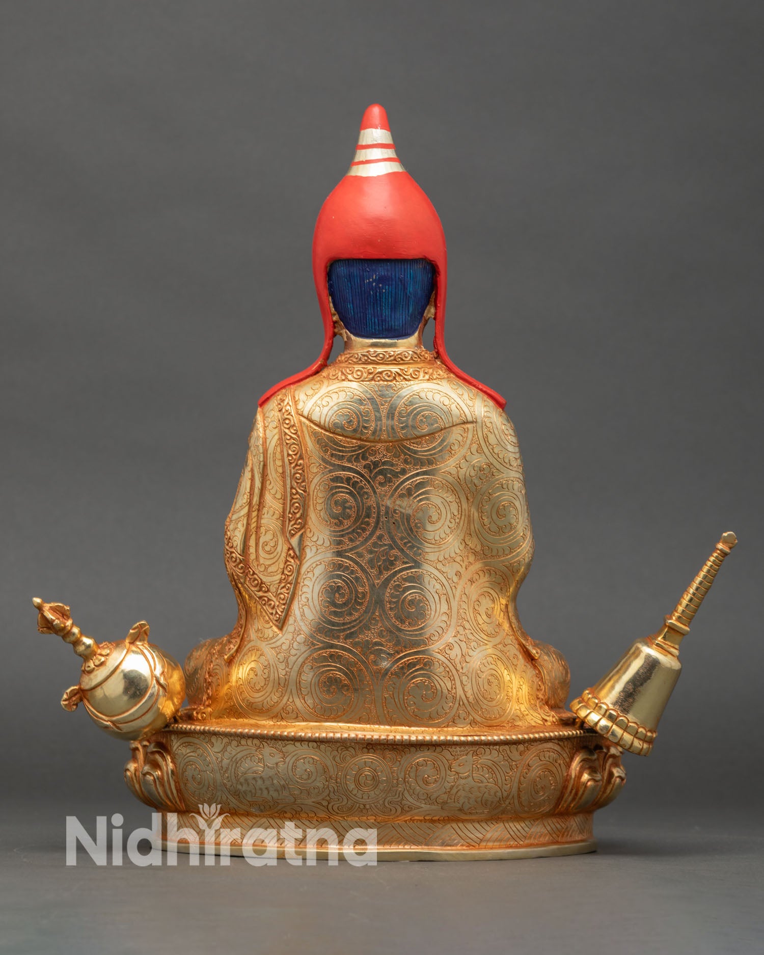 Back view of Atisha Dipankara statue showing detailed robes and lotus throne