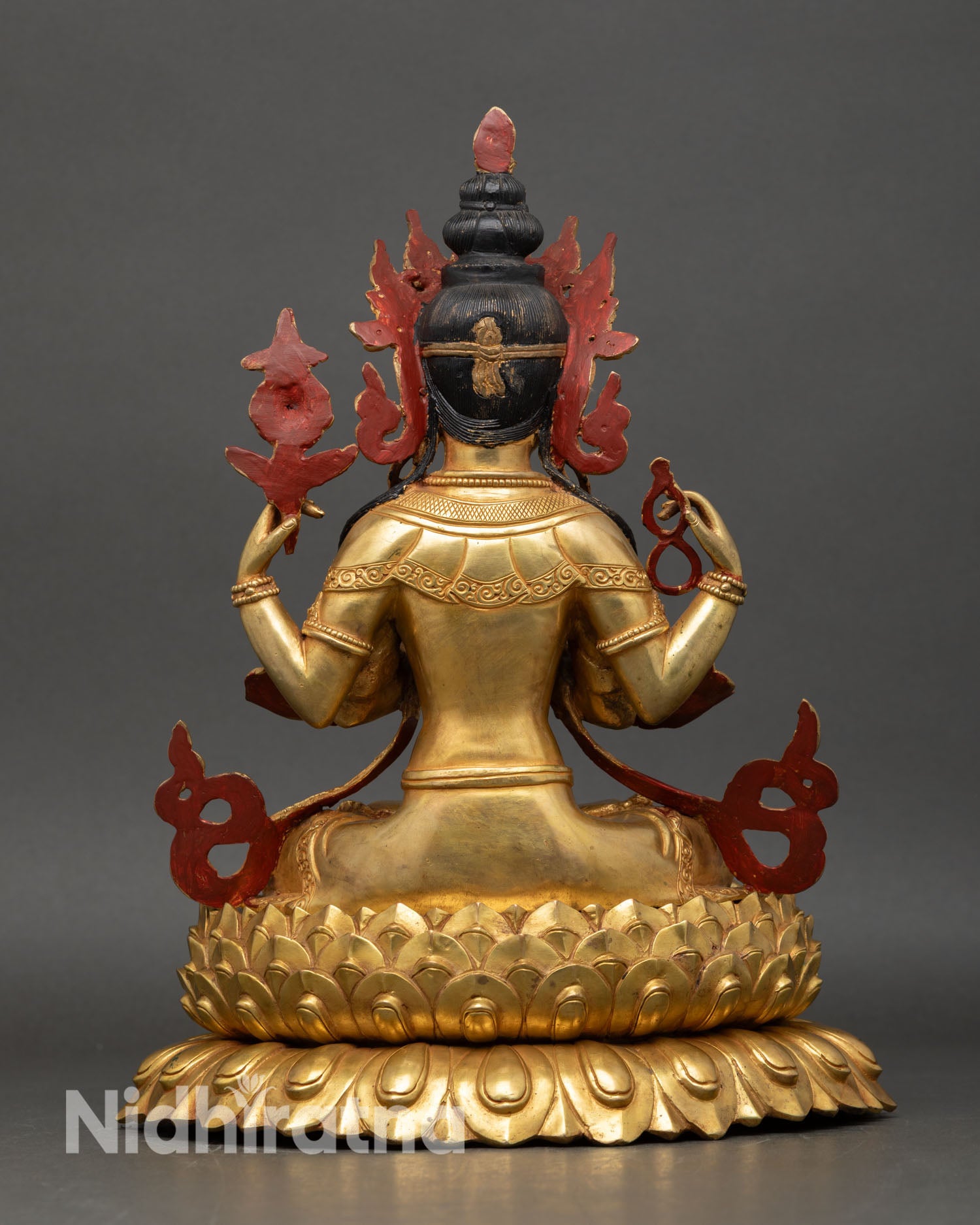 back view of chenrezig statue, engraved lotus pedestal and ornate bodhisattva details