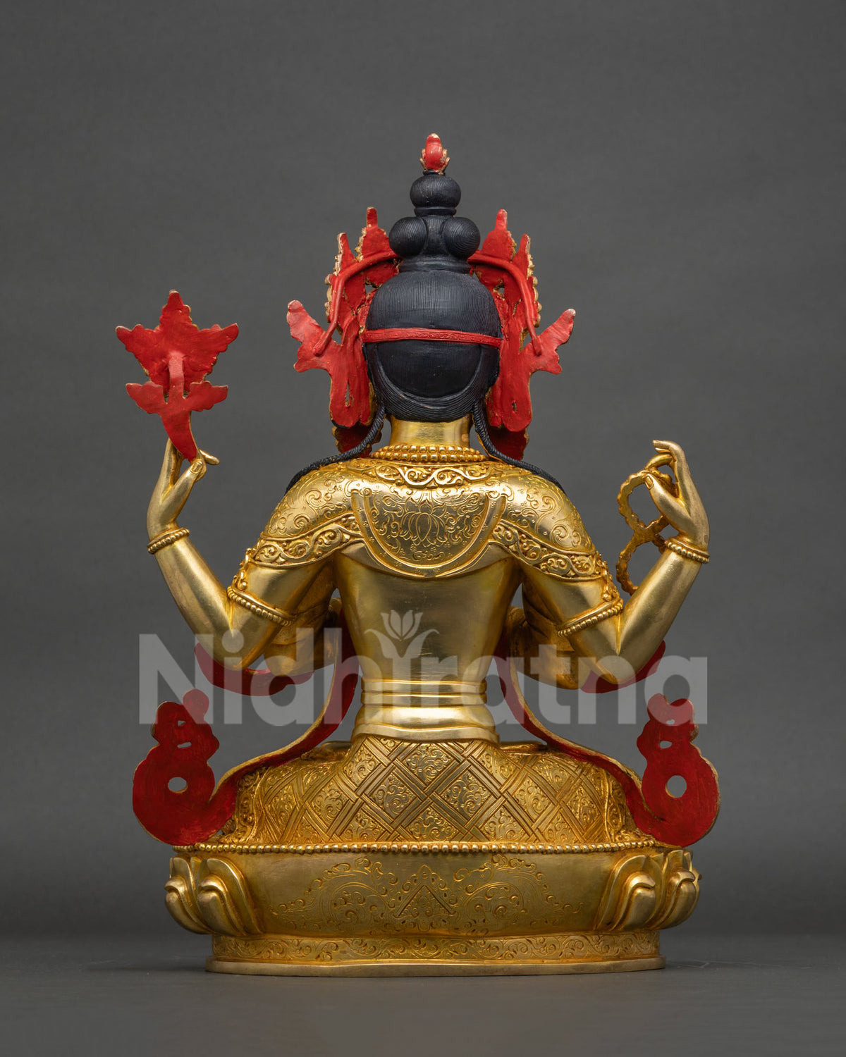 Back view of Chenrezig statue showing crown detail and hair carving