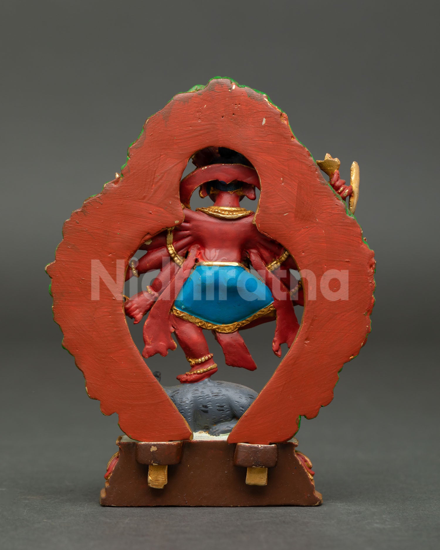 Back view of compact Ganesh statue made in copper with vibrant acrylic finish gold accents and spiritual Hindu home altar decorative design.