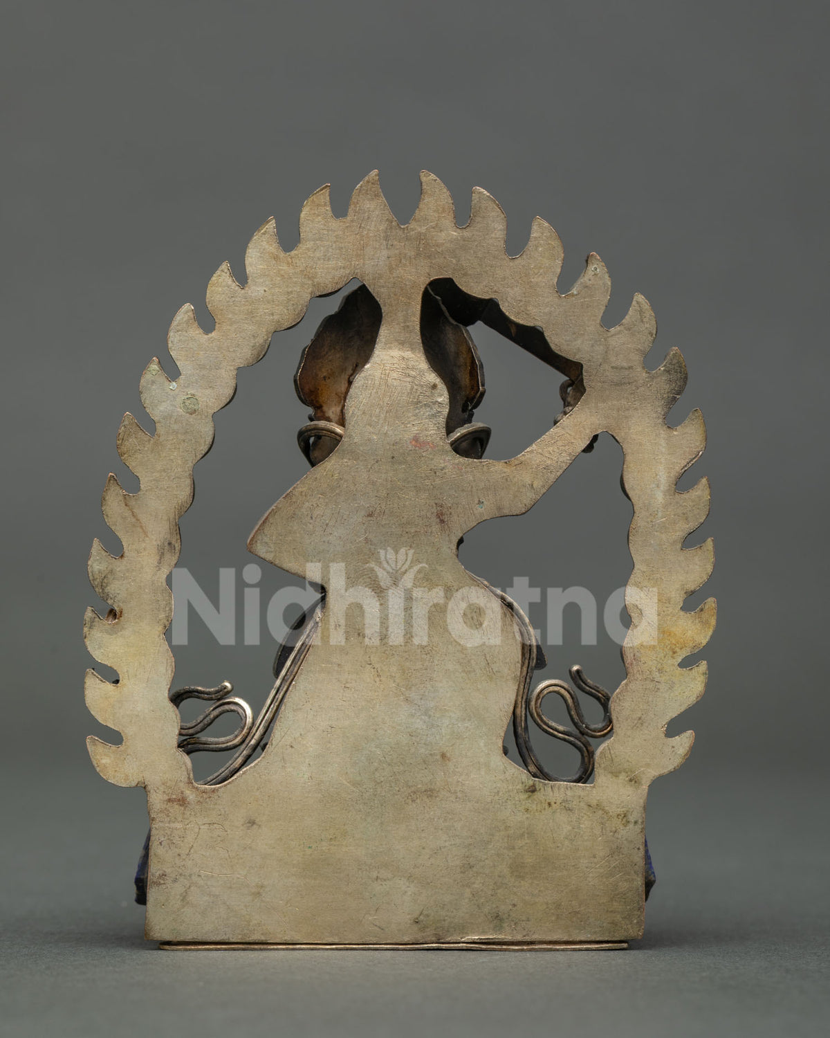 back view of copper sankata devi statue from nepal showing flame halo and newari craftsmanship