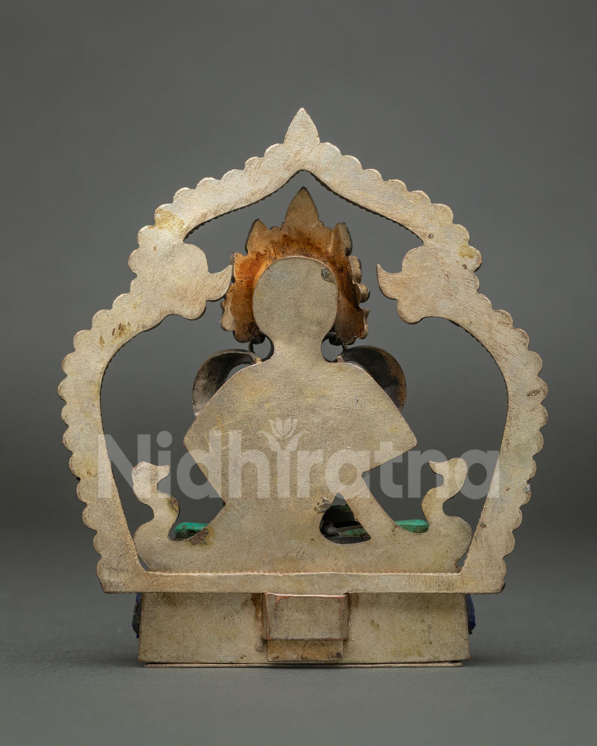 Back view of copper Vajrasattva statue showing the solid backplate and halo, handmade in Nepal