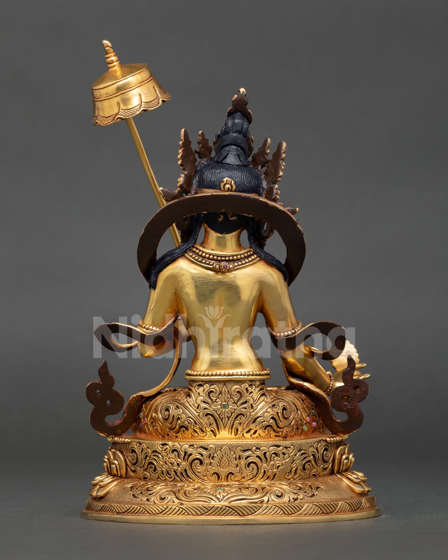 Back view of Dukkar White Umbrella Goddess statue with ornate repoussé and chased details