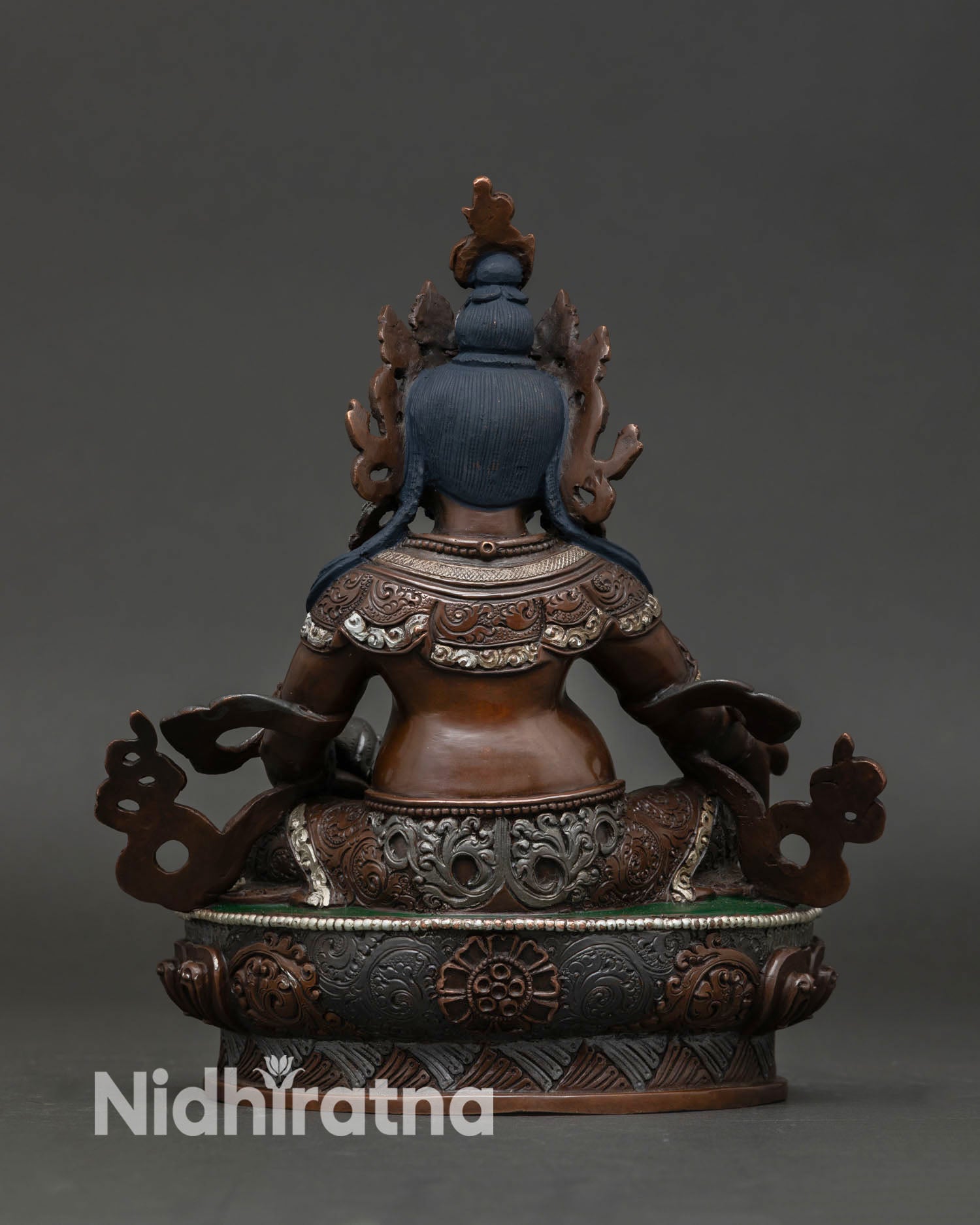 Back view of Dzambhala Buddhist statue in seated posture, ideal for meditation space home altar and spiritual prosperity decor