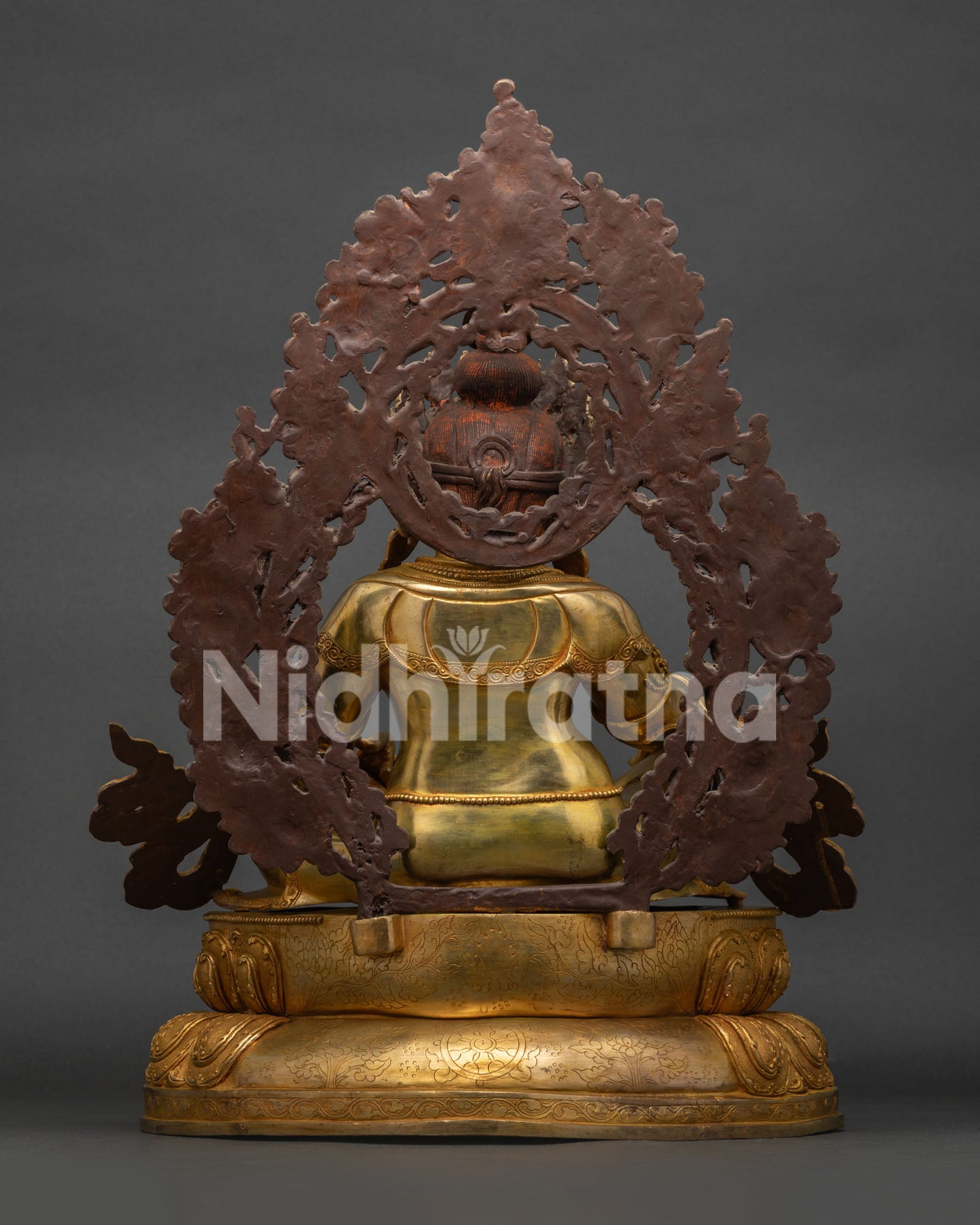 Back View of Dzambhala Statue Featuring Ornate Halo and Traditional Craftsmanship