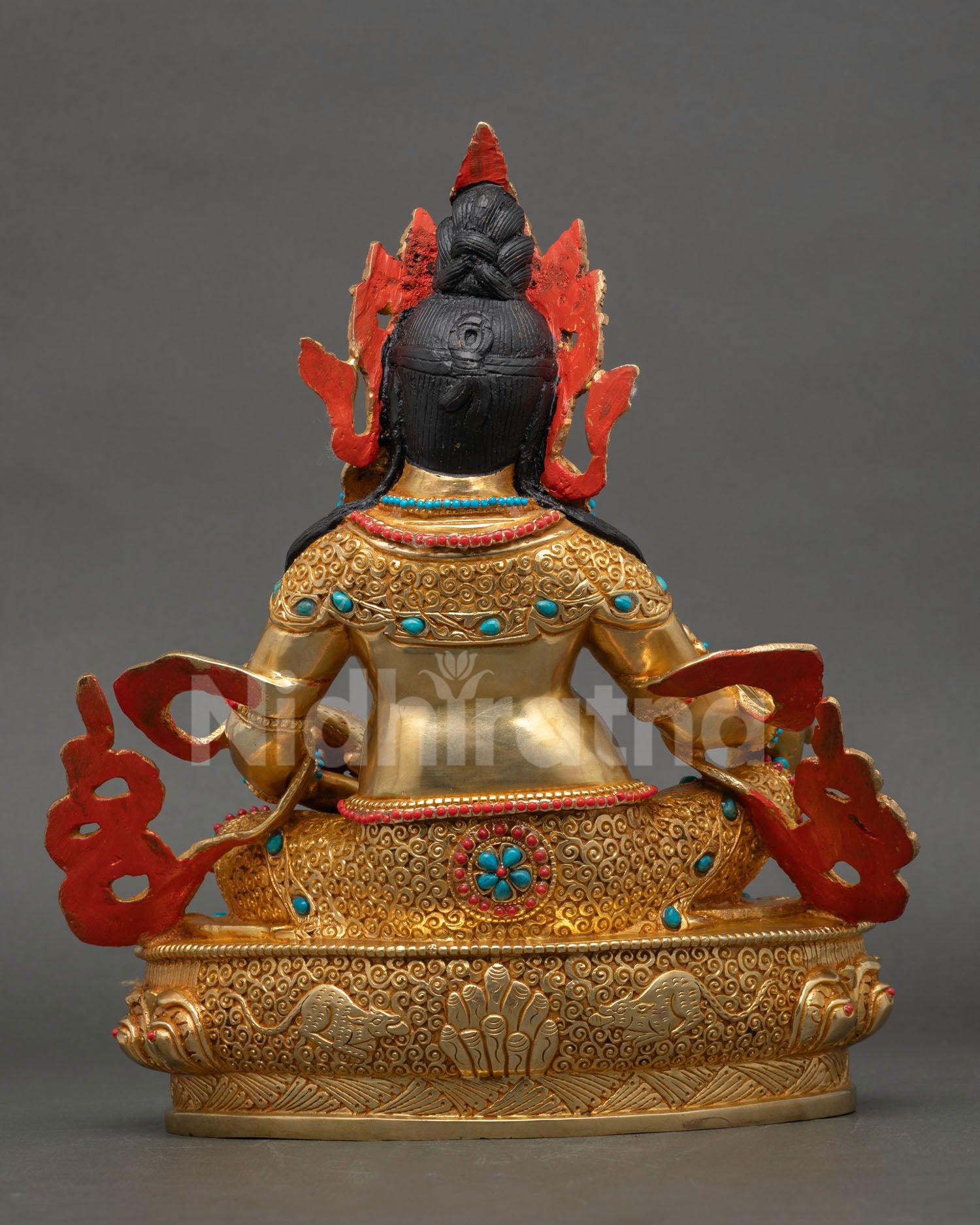 Back view of Dzambhala statue highlighting copper body gold gilding and Nepalese artisan metalwork details