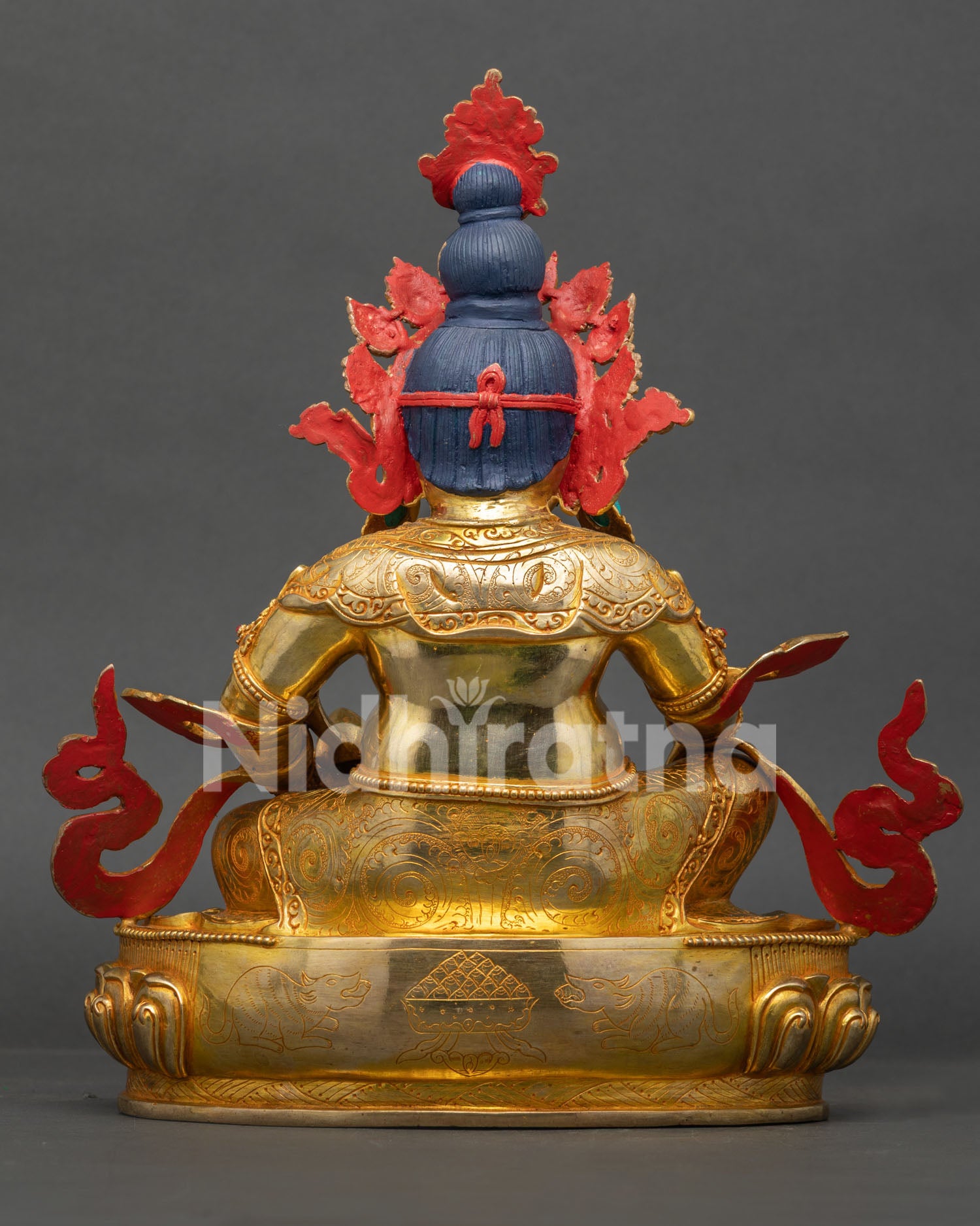Back view of Dzambhala Statue highlighting detailed robe carvings and authentic Himalayan Buddhist metalwork