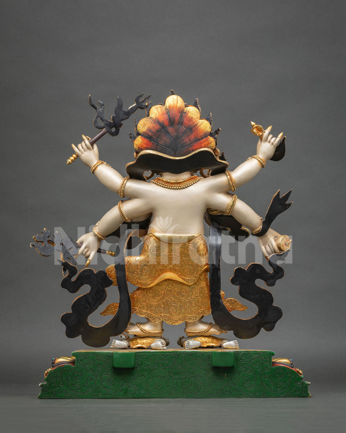 Back view of flame aureole encircling the White Mahakala protector statue, handcrafted in solid copper