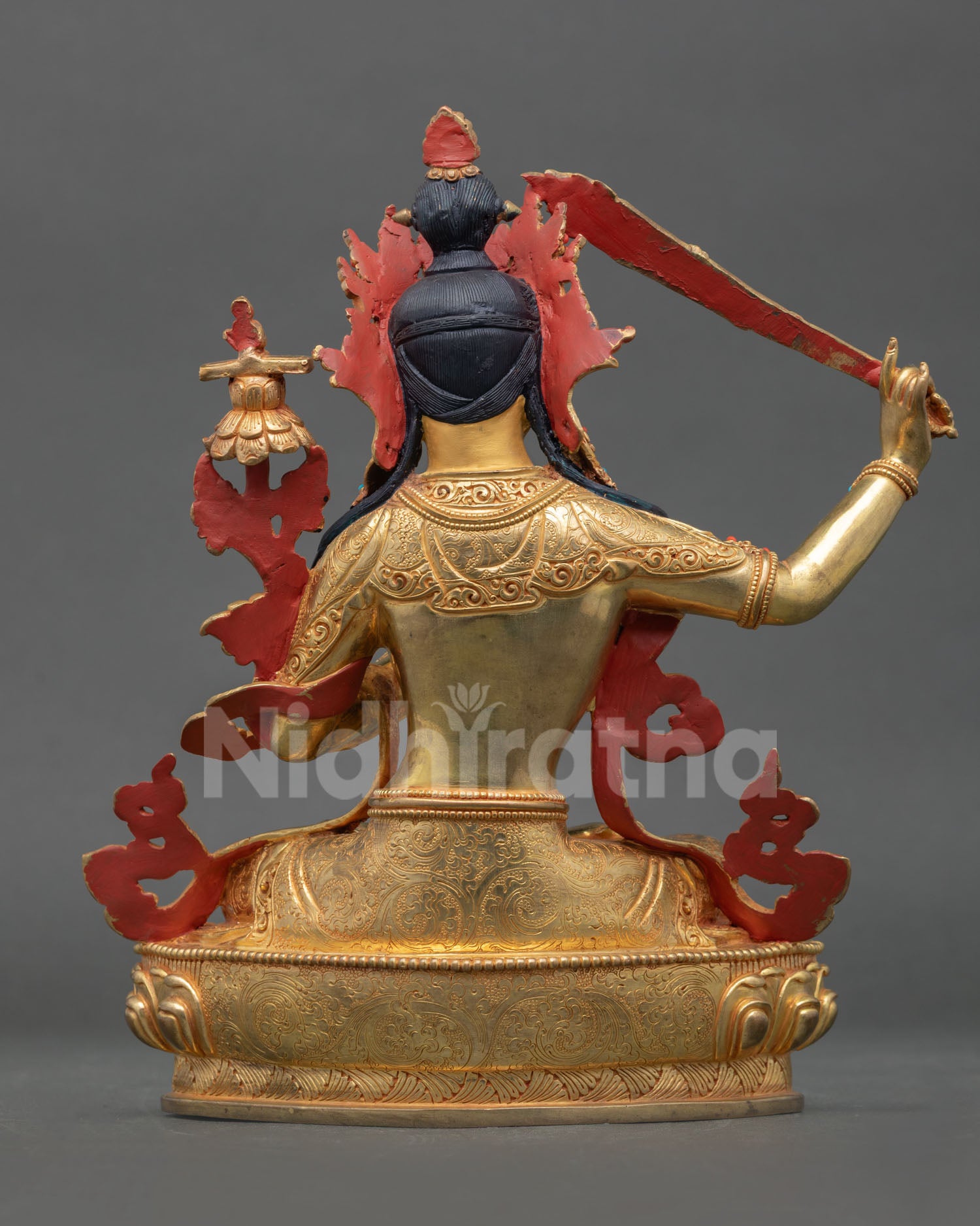 Back view of the gold-gilded copper Manjushri statue, handcrafted in Nepal