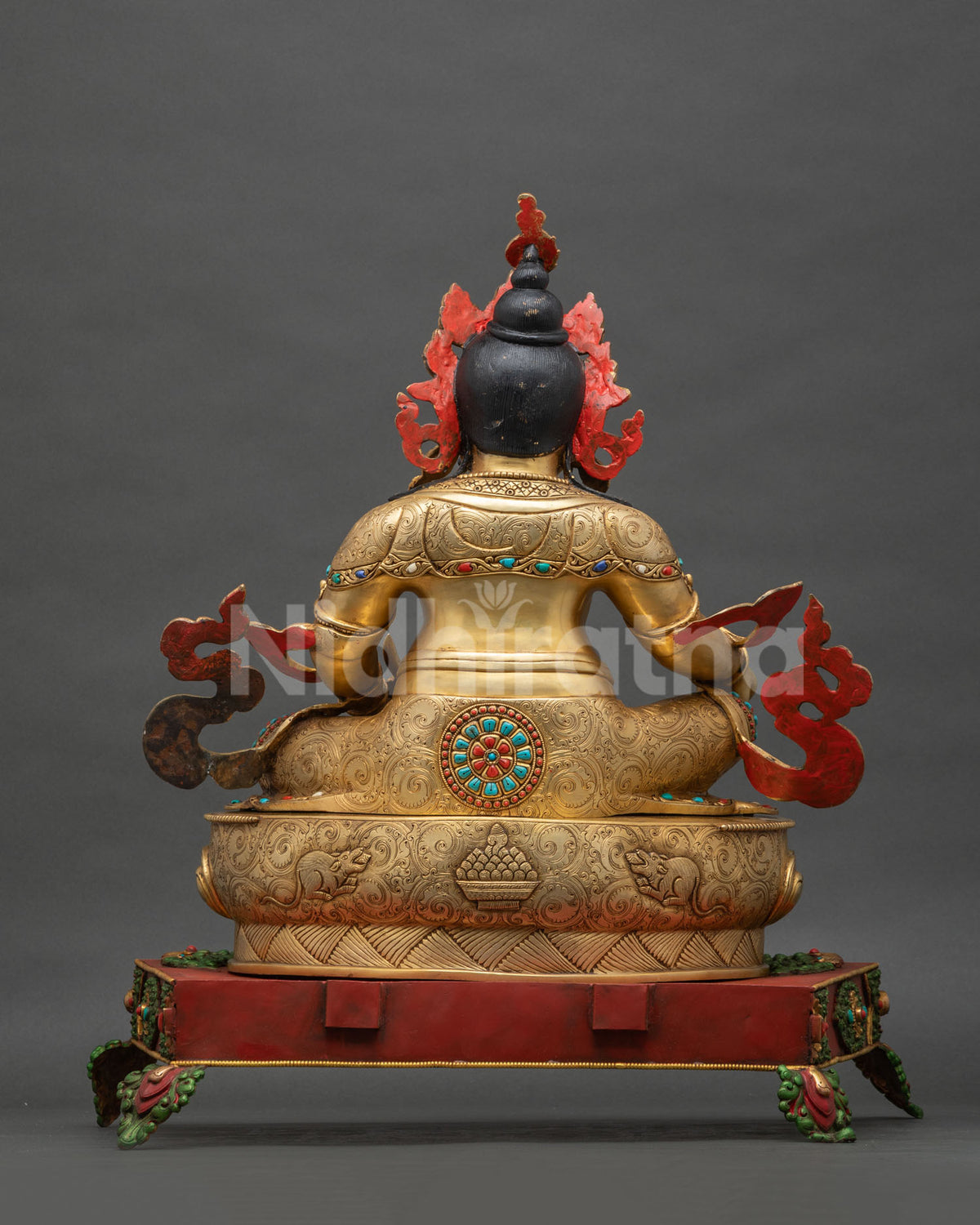 Back view of gold gilded Dzambhala throne statue, handmade Nepali Buddhist sculpture