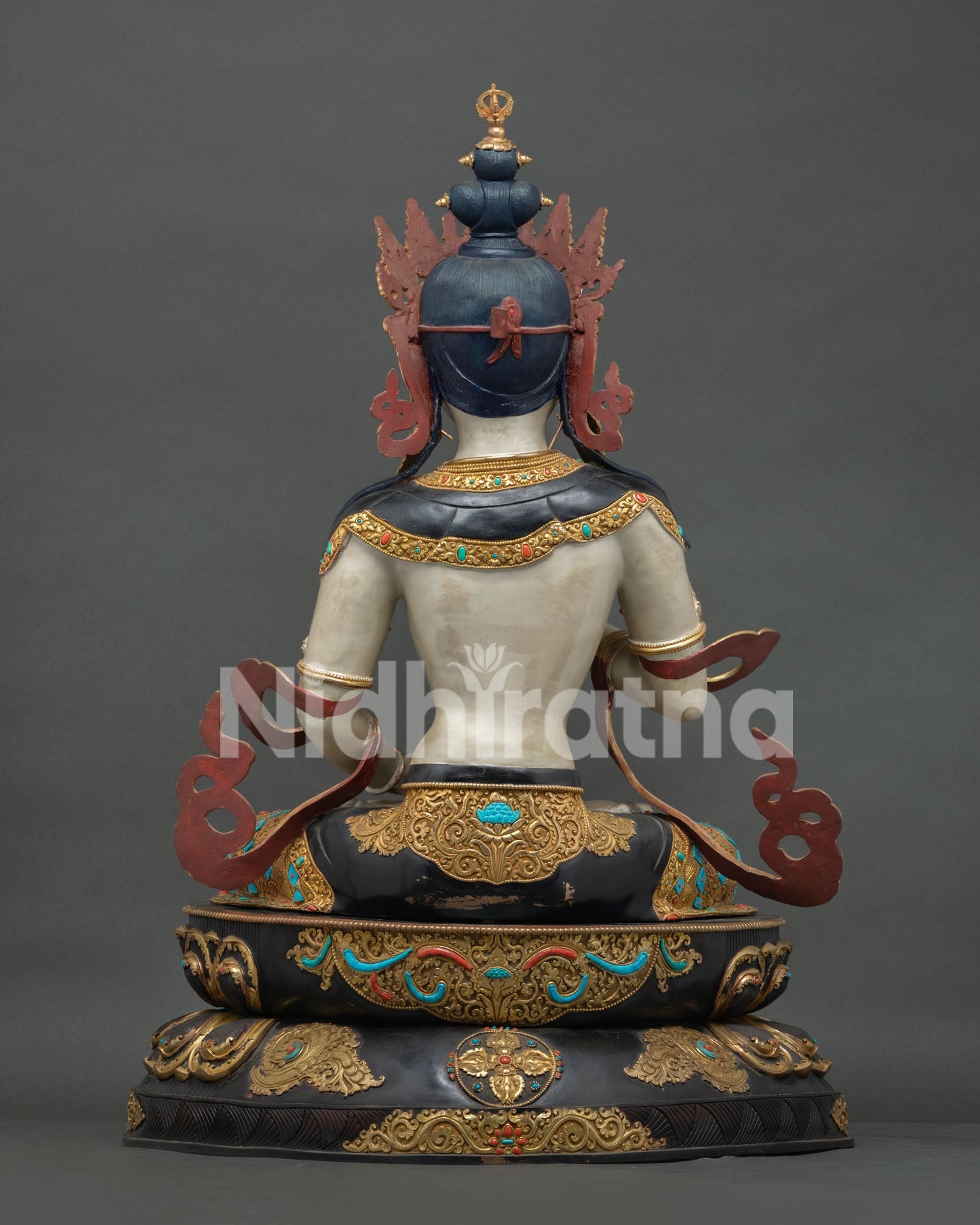 Back view of grand Vajrasattva Dorje Sempa statue, blue-black ushnisha, gold repoussé lower robe, stupa crown finial