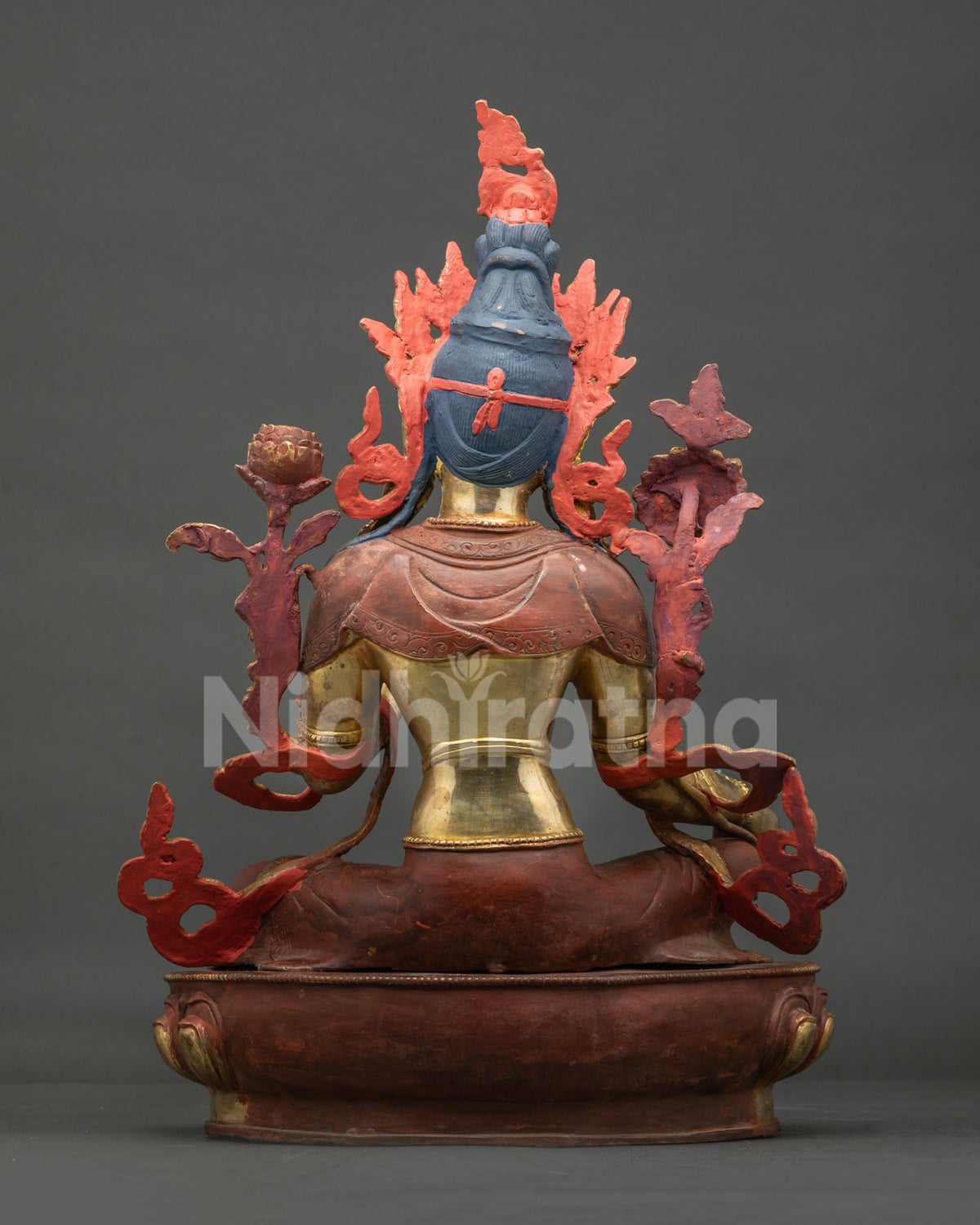 Back view of Green Tara Buddhist statue showing detailed copper craftsmanship and robe patterns