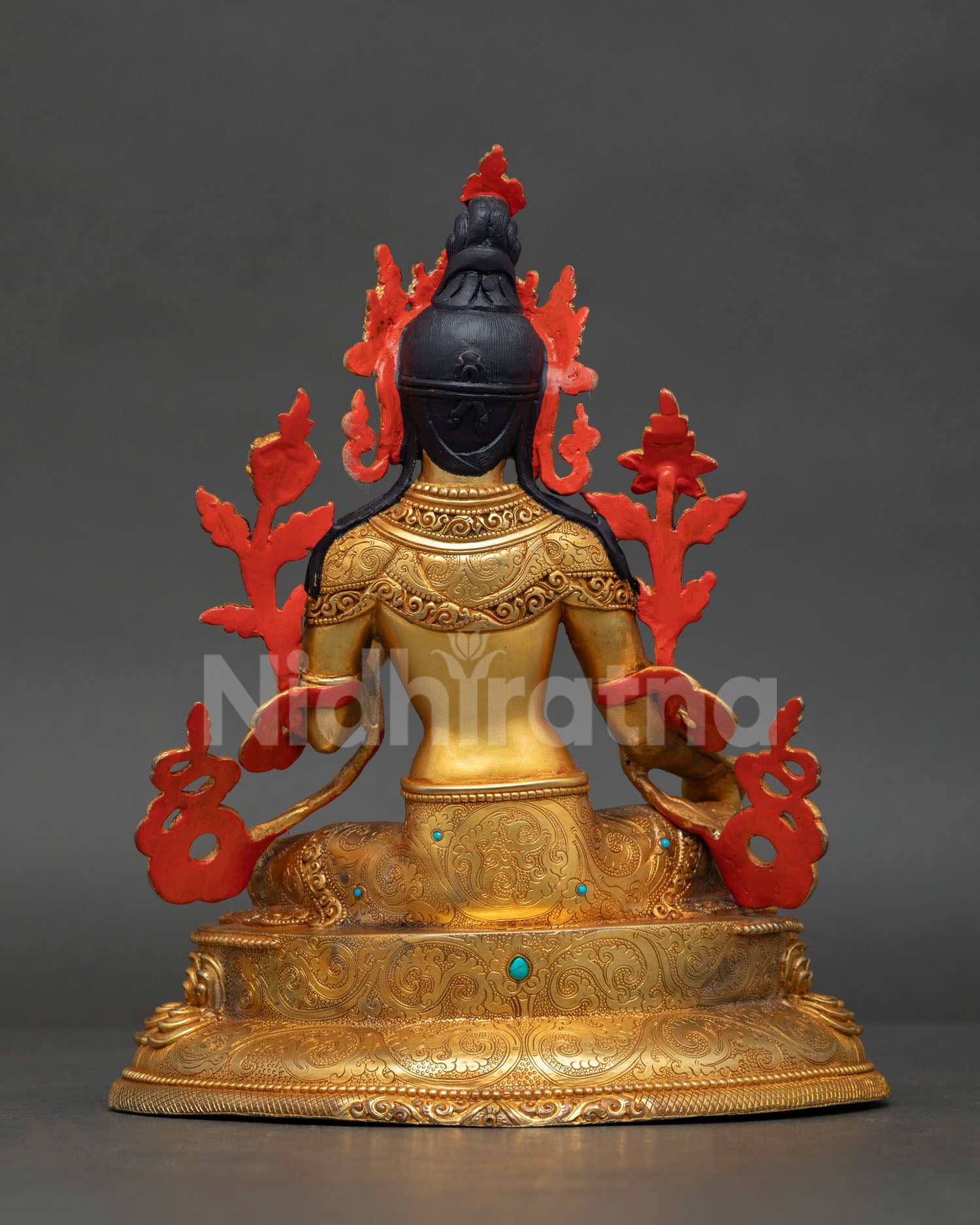 Back view of Green Tara statue featuring detailed craftsmanship and decorative engravings