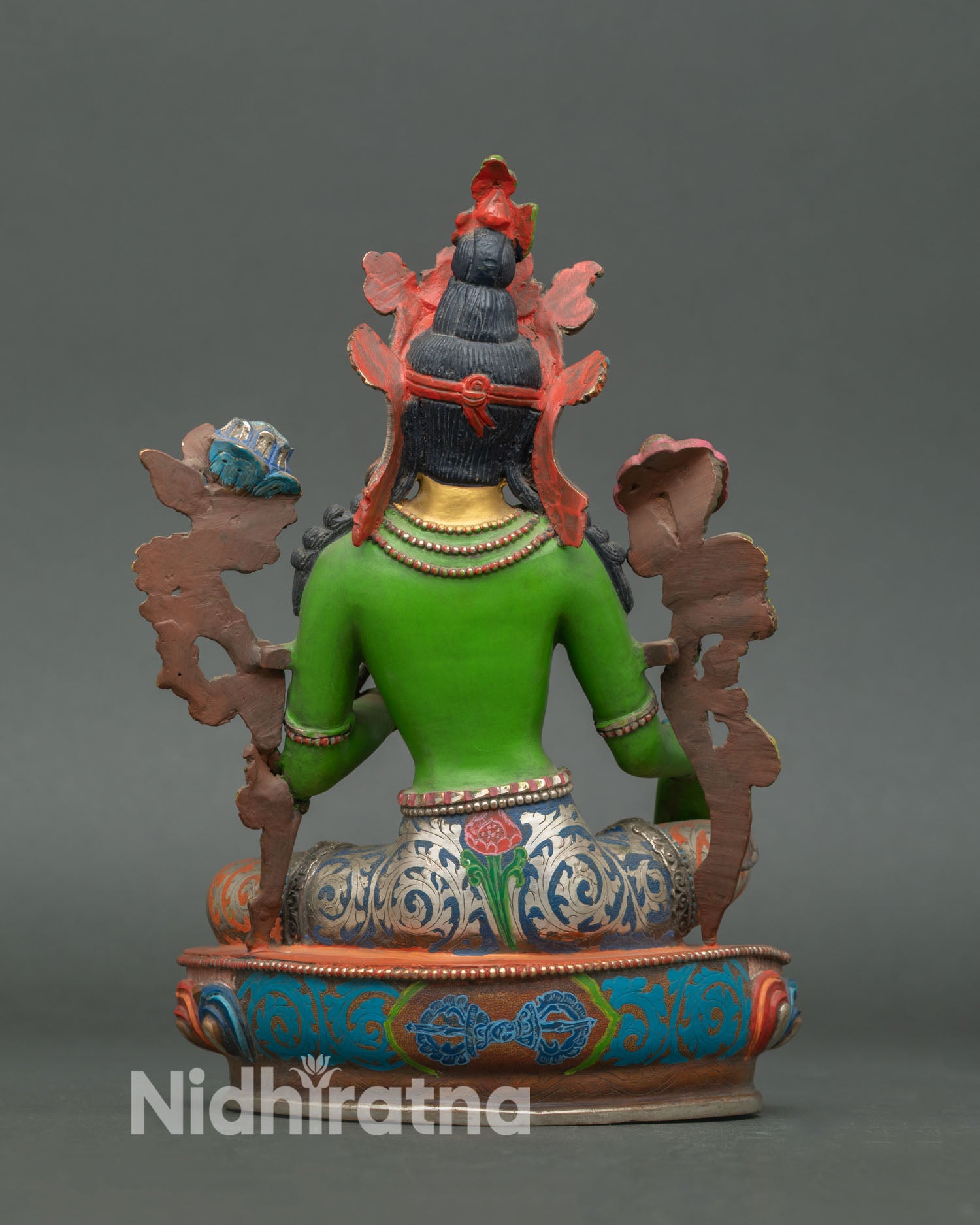 Back view of Green Tara statue highlighting detailed copper carving, floral lotus base design, and traditional Nepalese sacred spiritual artwork