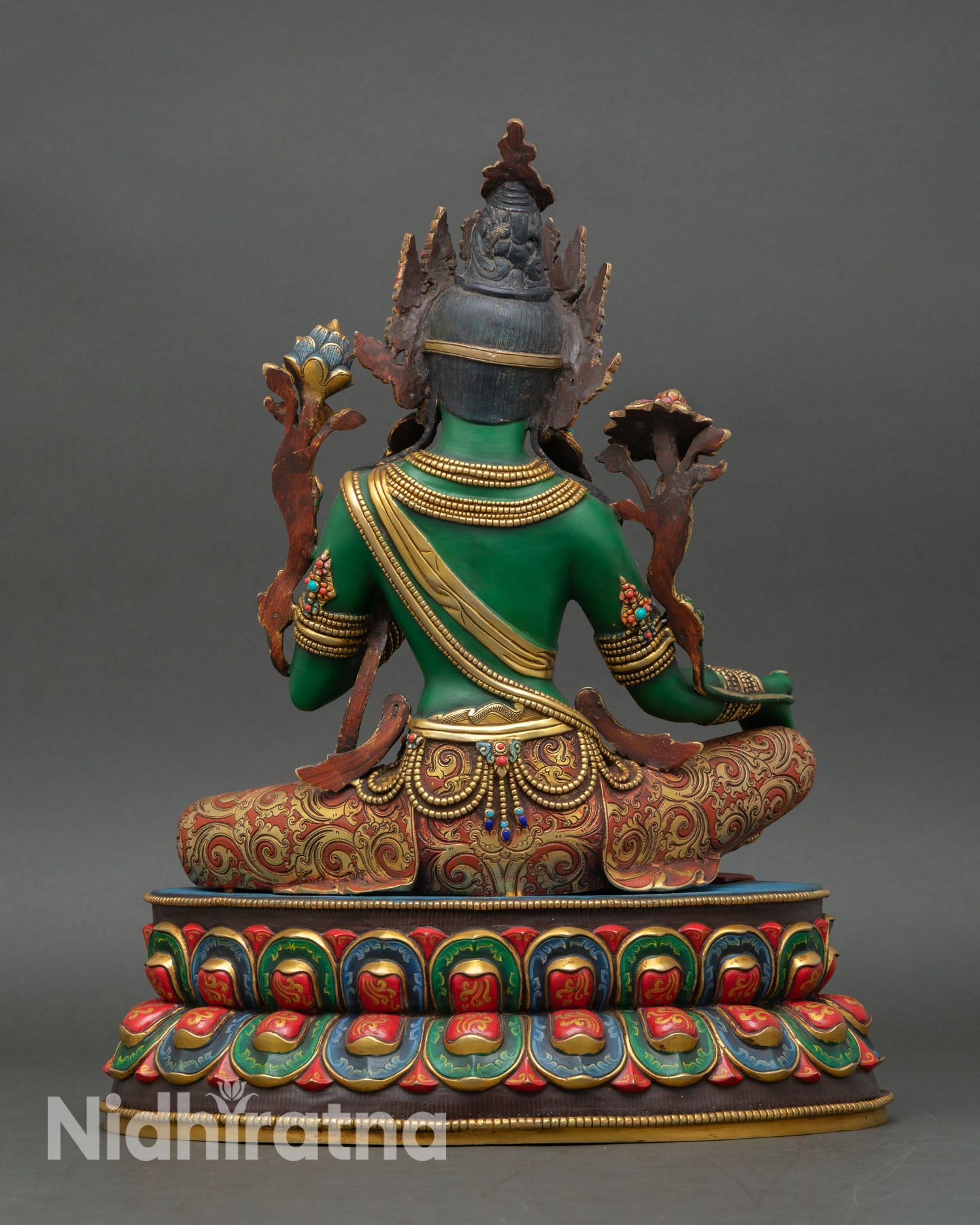 Back view of Green Tara statue showing copper craftsmanship and detailed decorative carvings