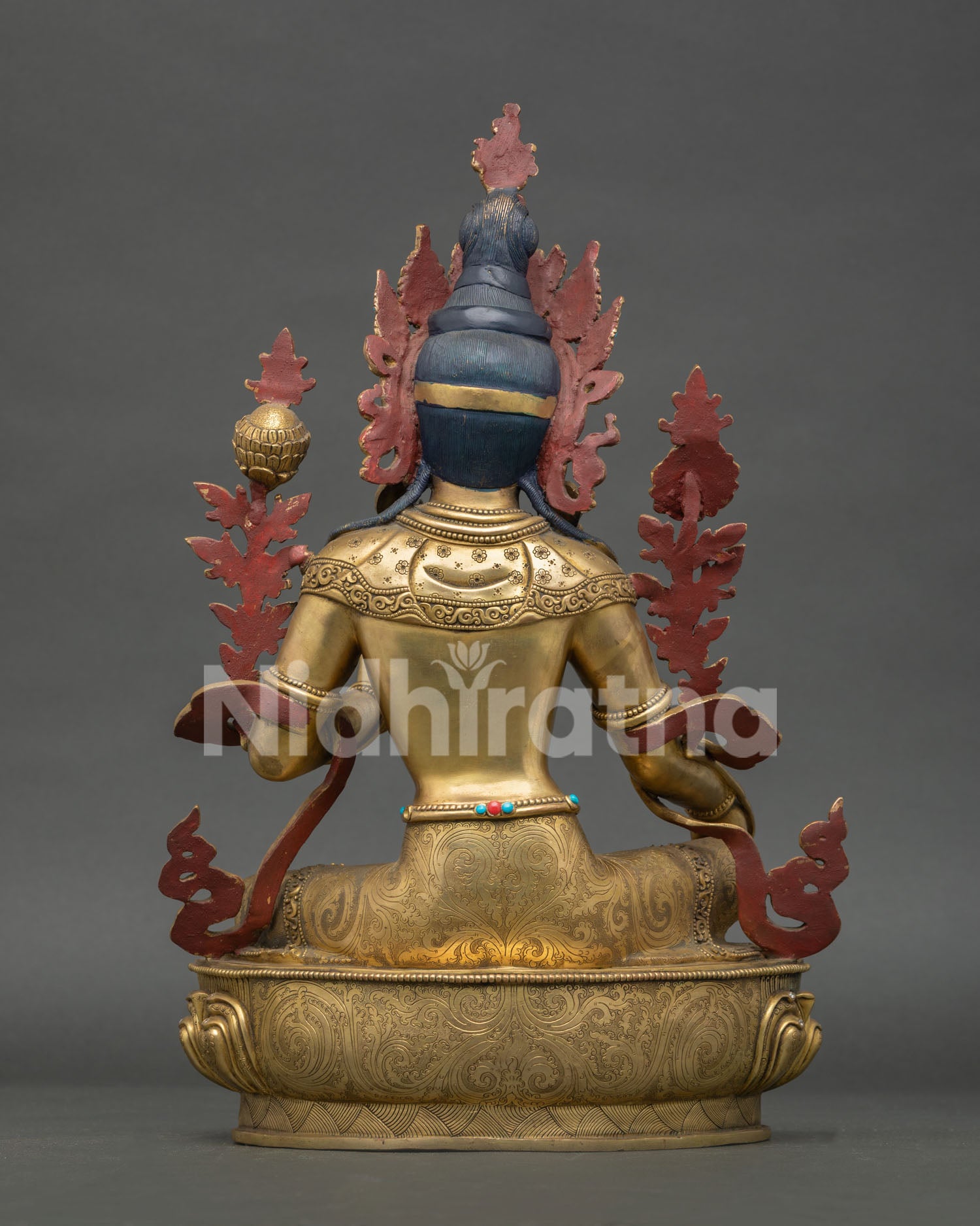 back view of green tara statue with engraved lotus throne and handcrafted details