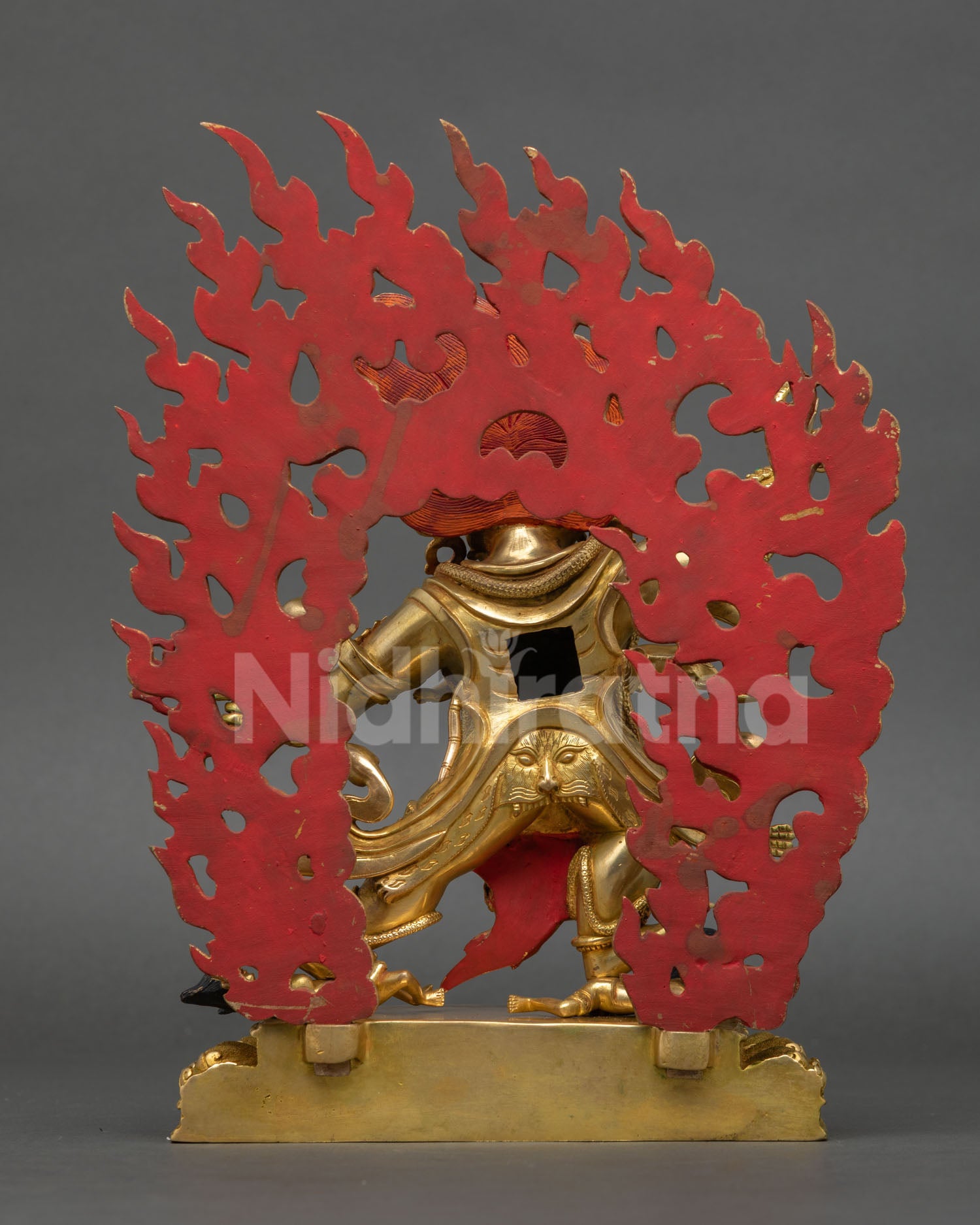 Back view of Guru Dragpo statue displaying ornate halo and traditional craftsmanship