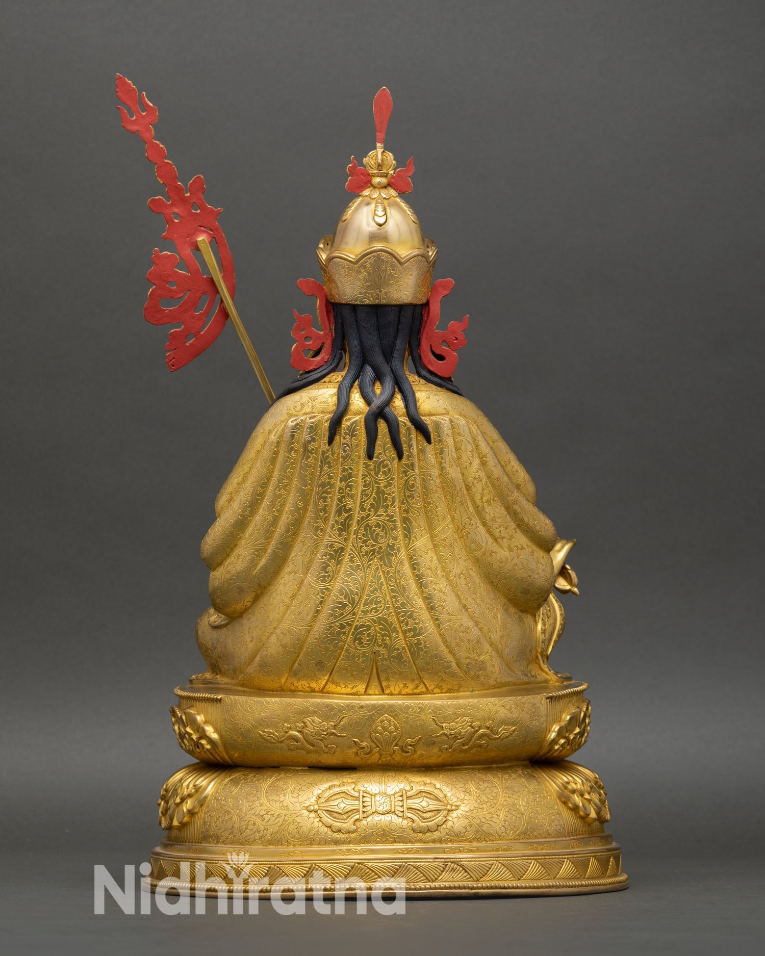 Back view of Guru Rinpoche statue highlighting handcrafted detailing in oxidized copper, made by skilled artisans of Nepal.
