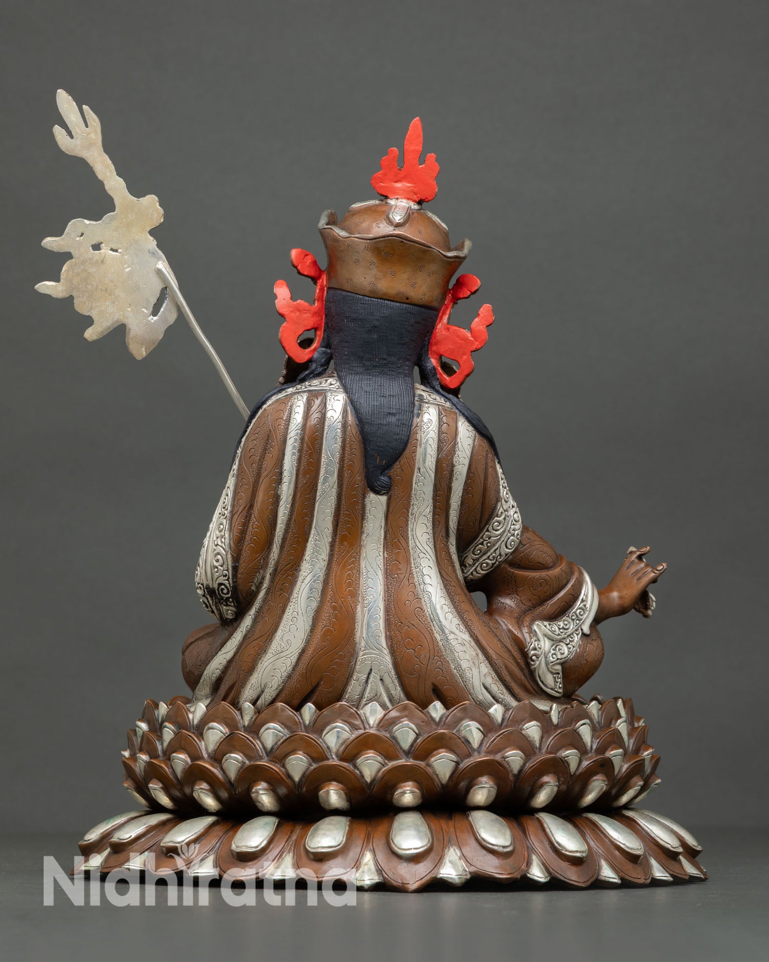 Back view of Guru Rinpoche statue with intricate robe detailing lotus seat design and traditional Newari artisan craftsmanship for meditation altar decor