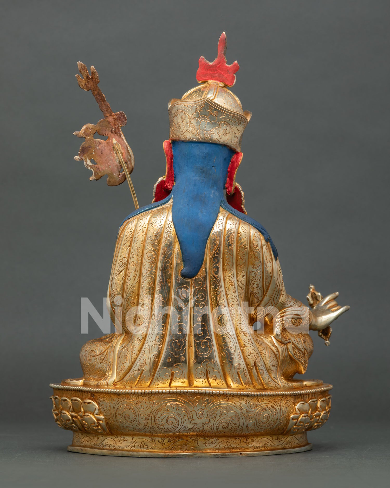 Back view of Guru Rinpoche statue with ornate lotus base and traditional Newari craftsmanship