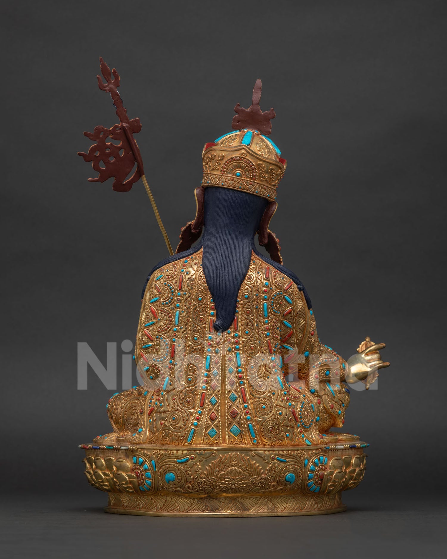 Back view of hand-carved copper Padmasambhava statue, Nepal fire-gilding work
