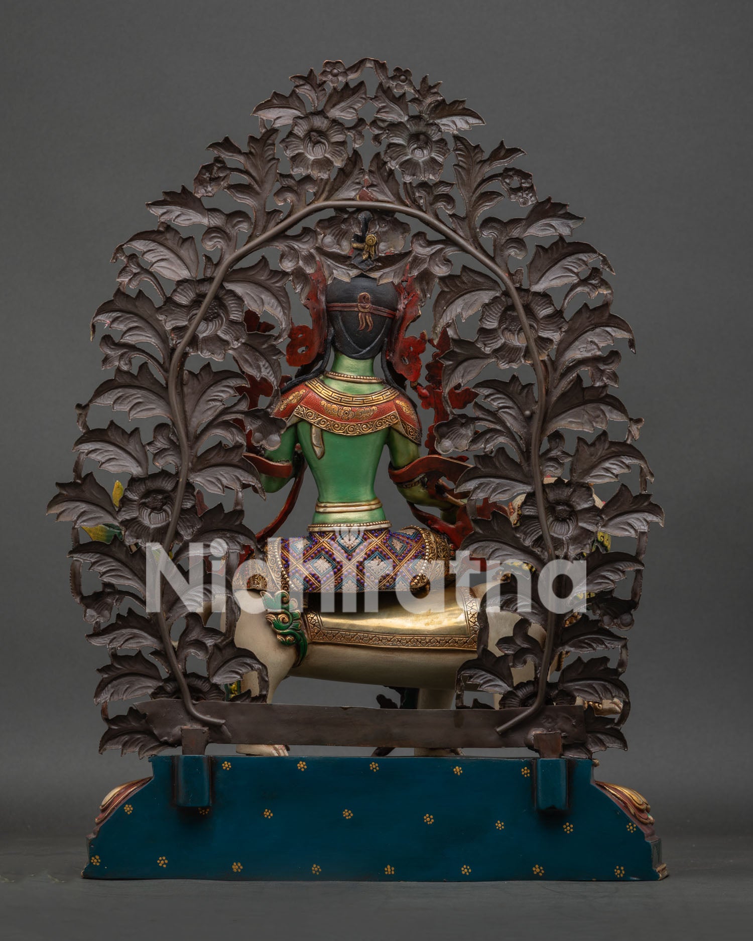 Back view of hand-carved floral aureole on Green Tara Buddhist statue