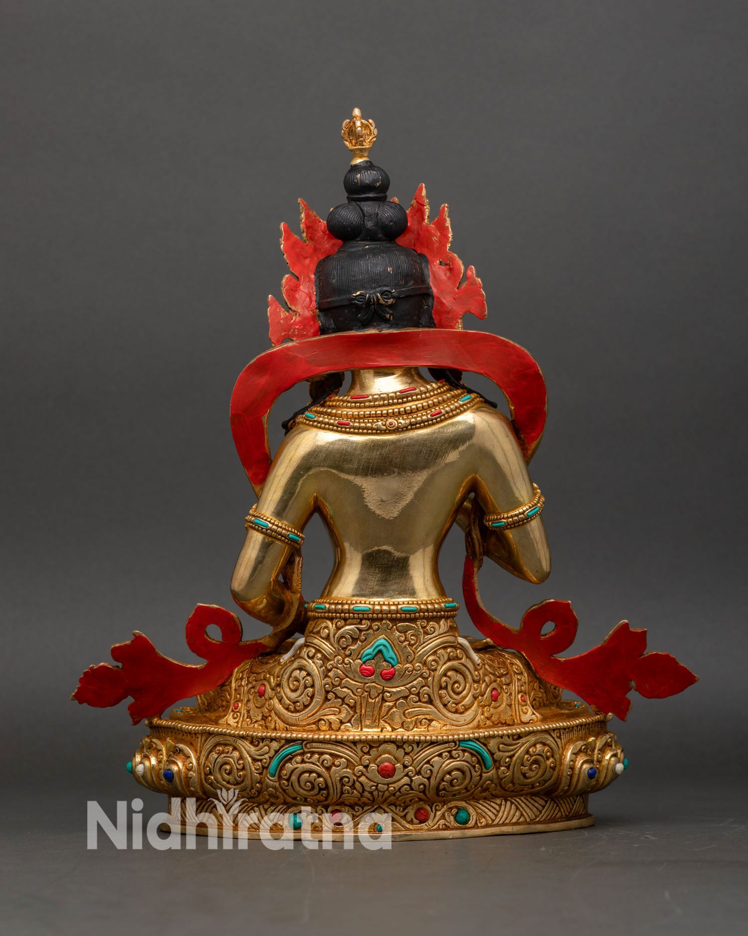 Back view of handcrafted copper Vajrasattva adorned with gold gilding and colorful stones