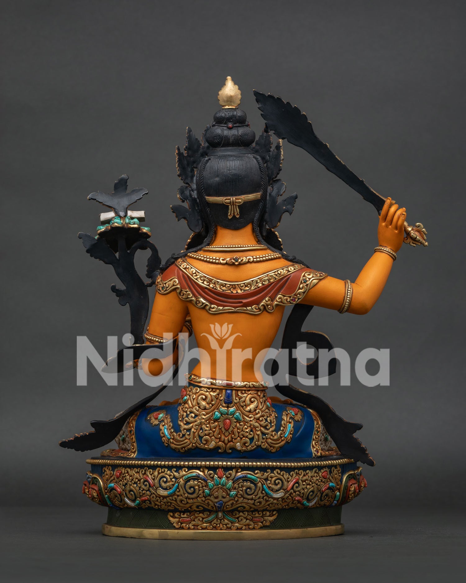Back View of Handcrafted Manjushri Statue Displaying Intricate Repoussé Work and Gold Gilded Finish