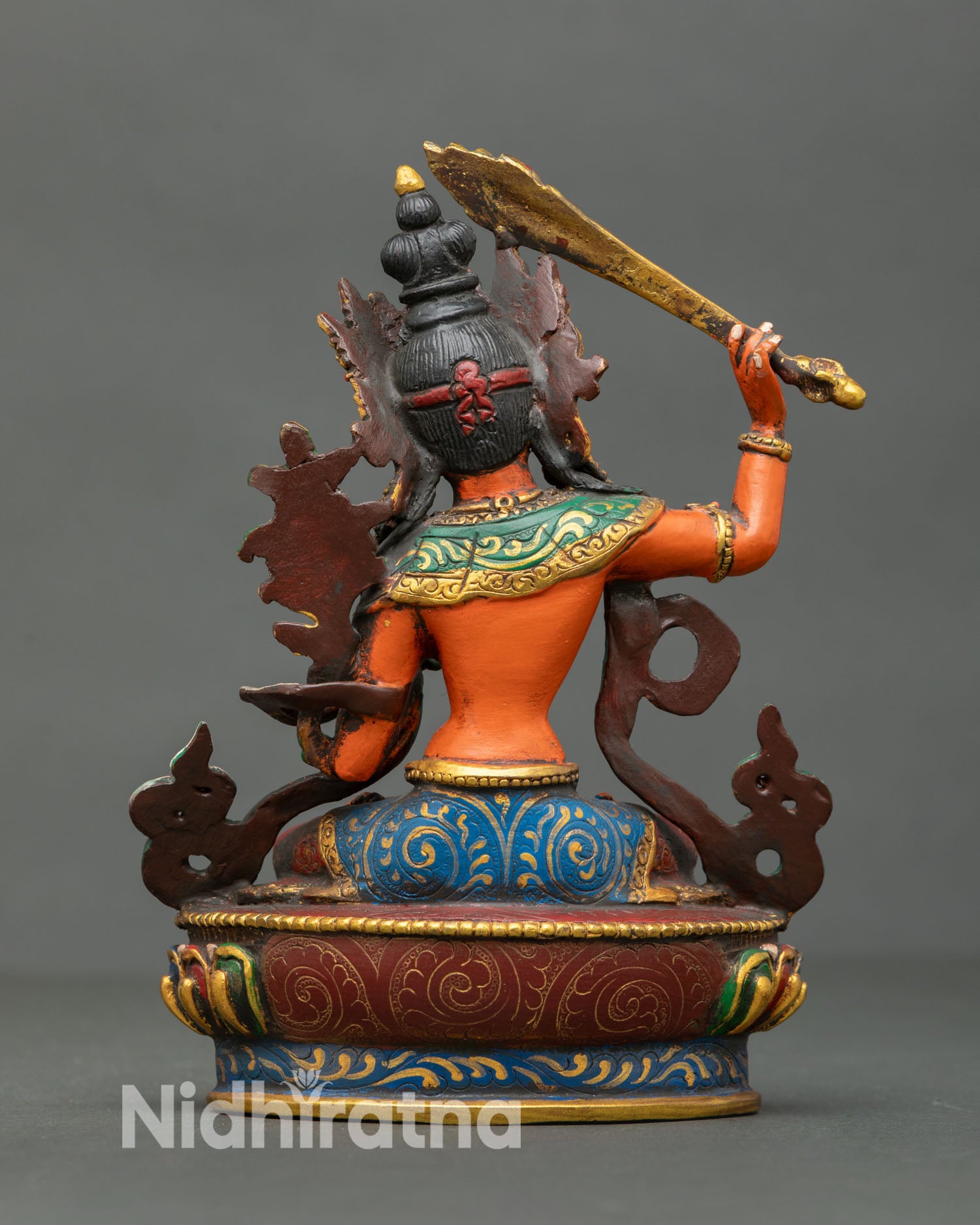 Back view of handcrafted Manjushri statue from Patan Nepal showing detailed copper craftsmanship lost wax technique